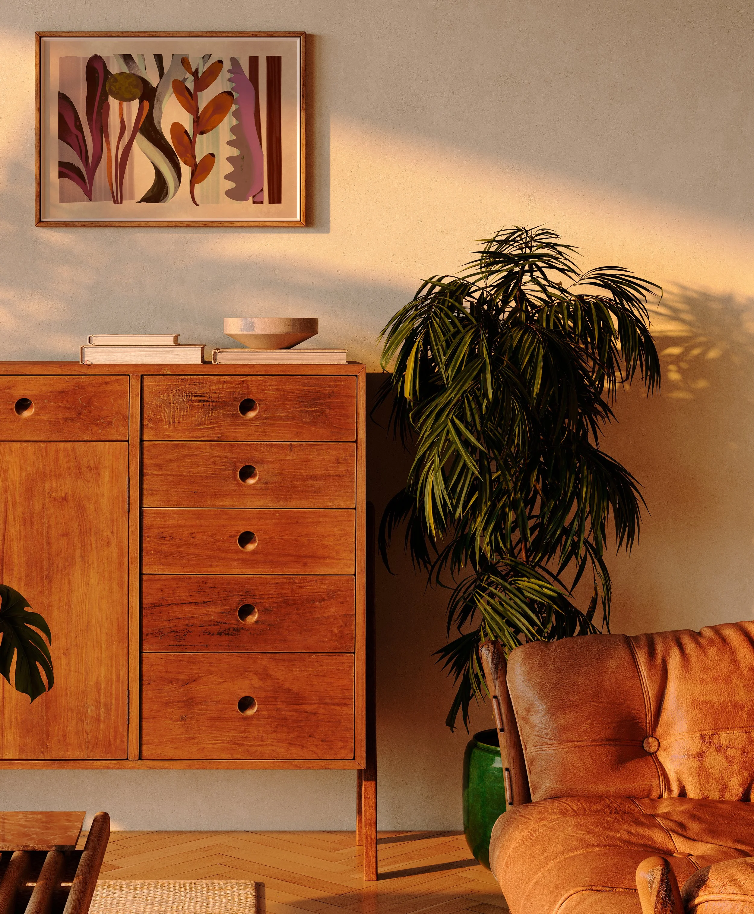 Warm, eclectic living room with a framed Very Strange art print above a wooden cabinet and leather chair.
