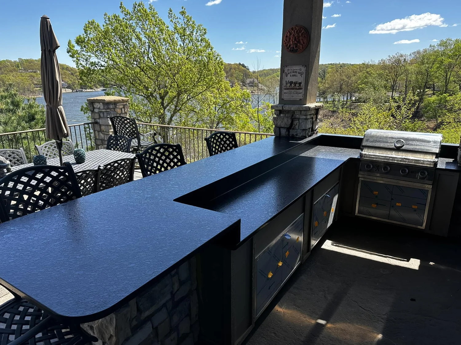 Finished stone countertop on an outdoor kitchen overlooking Grand Lake