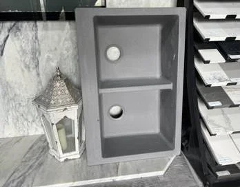 Pair of stone-look vessel sinks staged in the fabrication shop