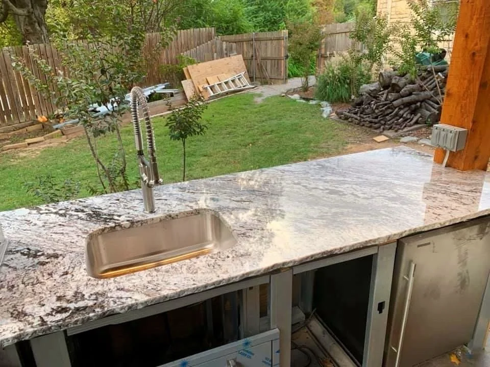 Outdoor stone prep counter with an undermount sink under construction