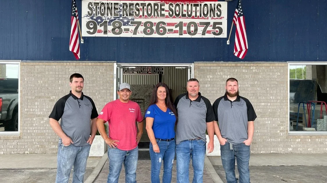 Stone Restore Solutions team member talking with customers at the Grove, Oklahoma showroom