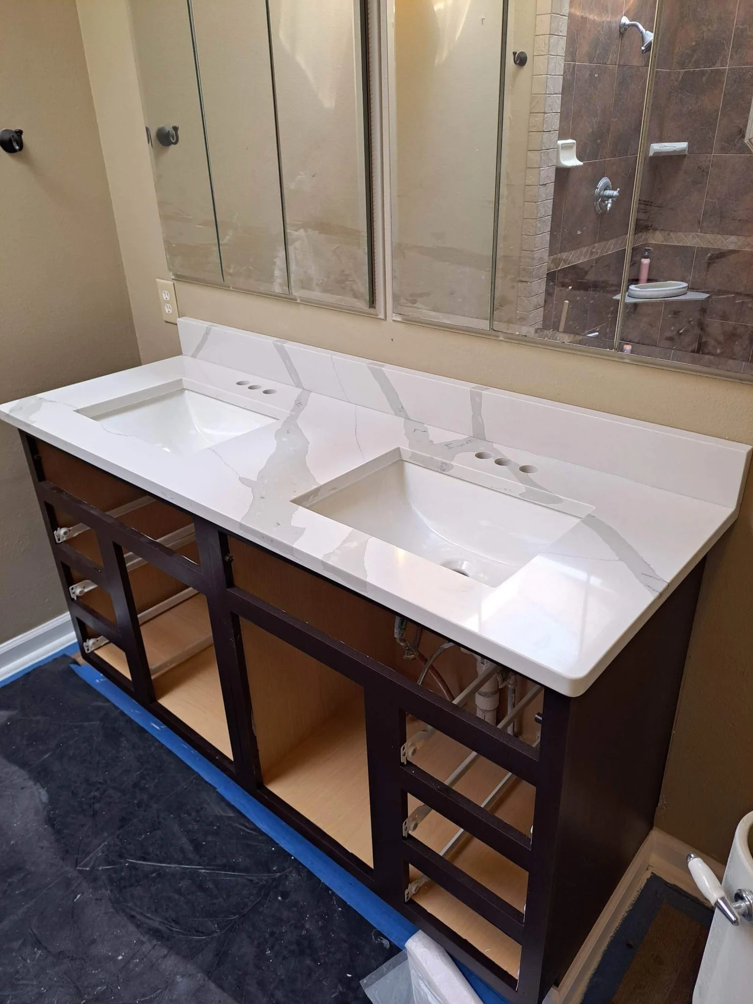 Stone bathroom vanity top with undermount sink installed in a Grove, Oklahoma home