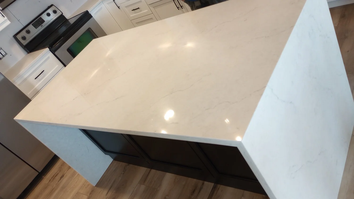 White quartz countertop with a thick mitered waterfall edge detail