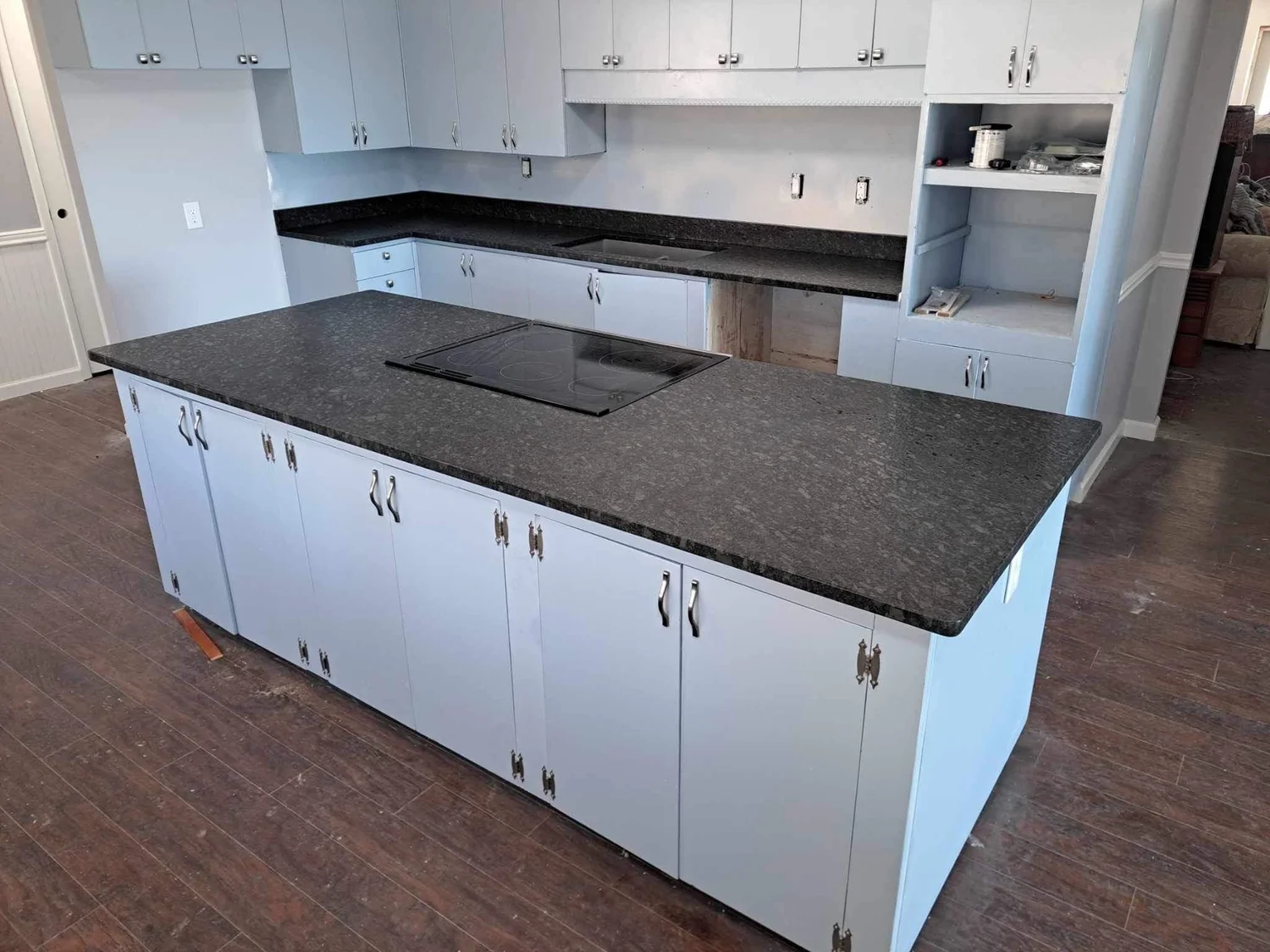 Two-level black granite bar countertop in a newly built kitchen
