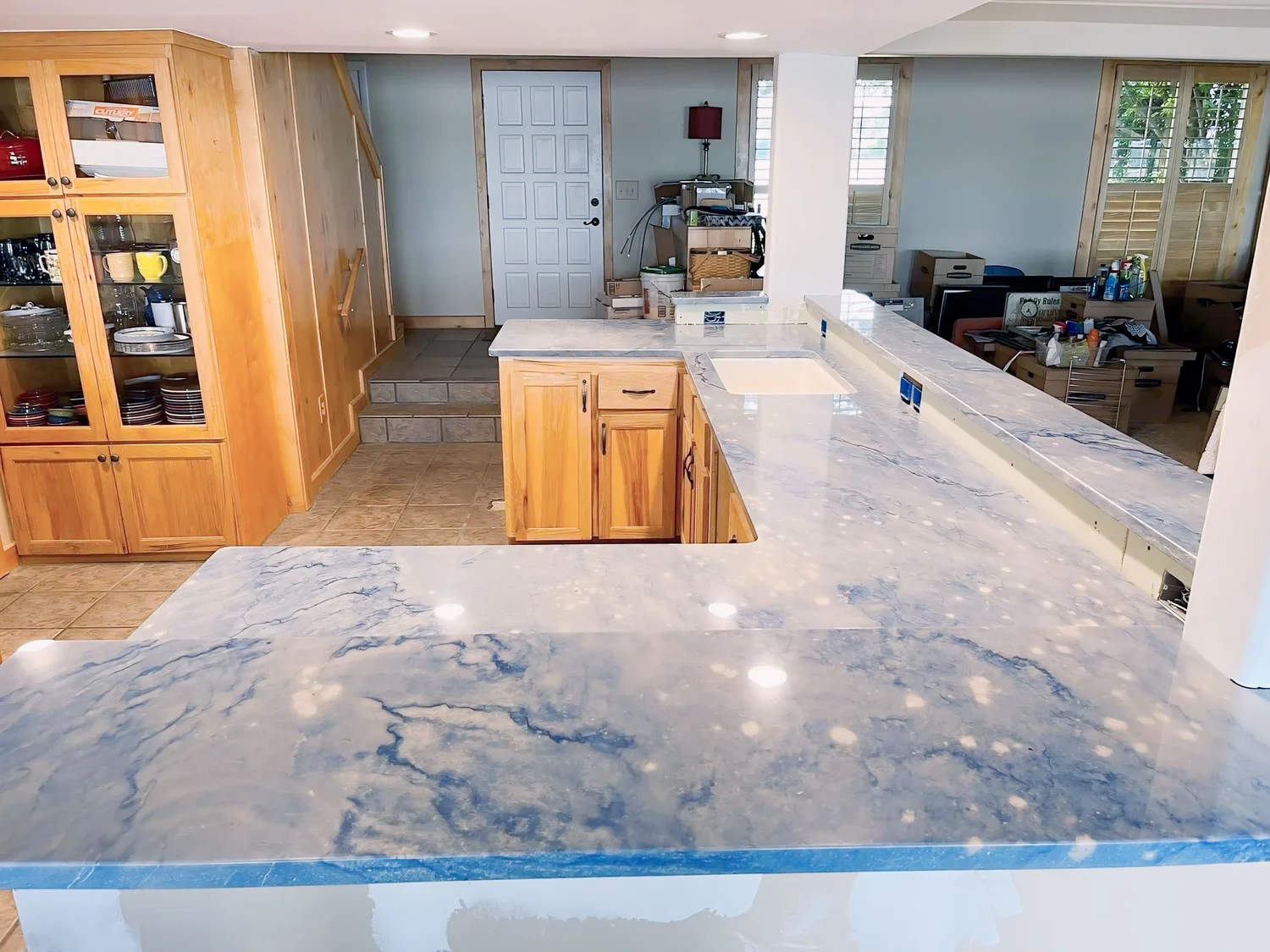 Bright white marble-look island top in a remodeled kitchen