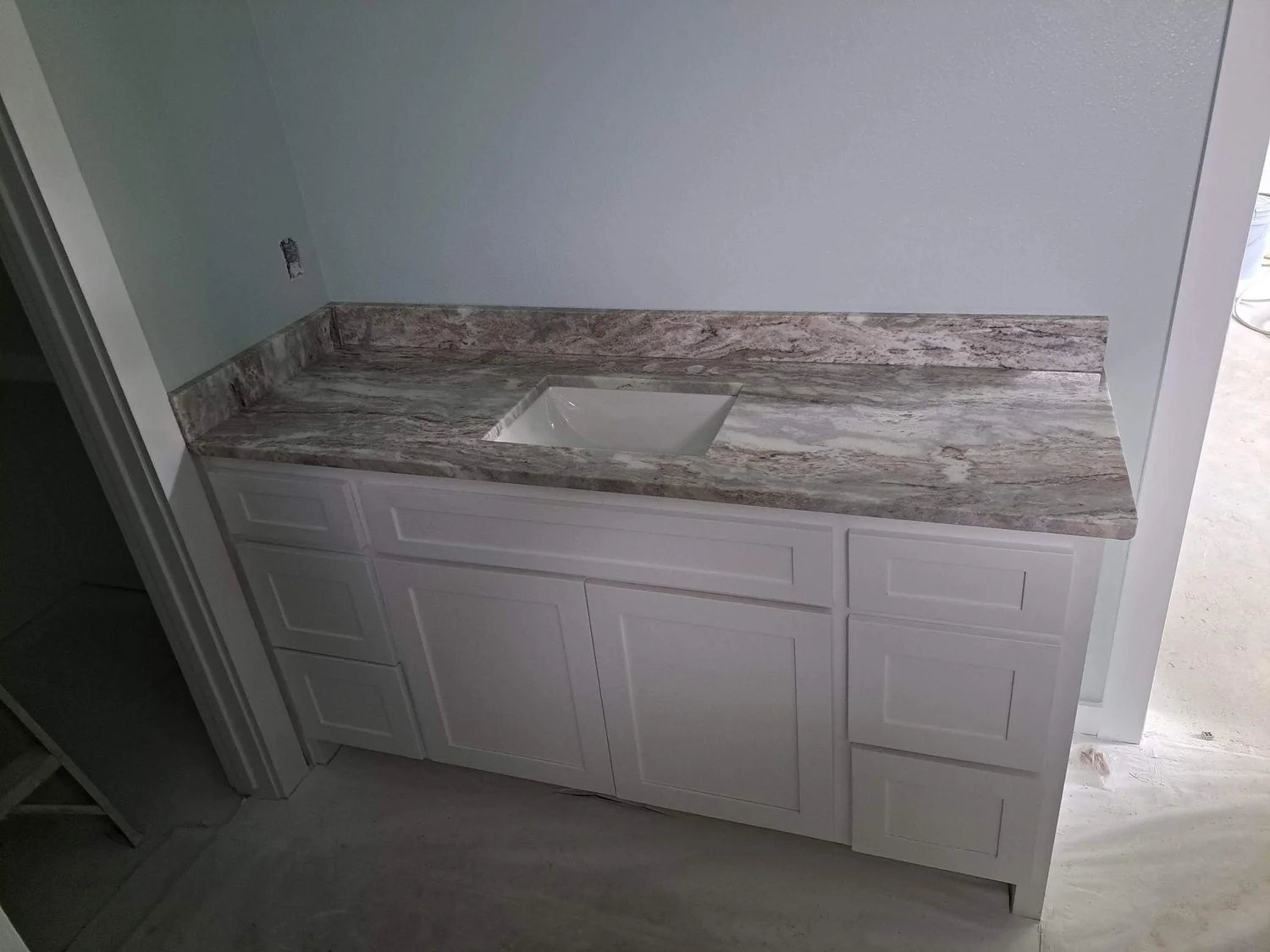 White quartz countertops installed in a freshly built kitchen