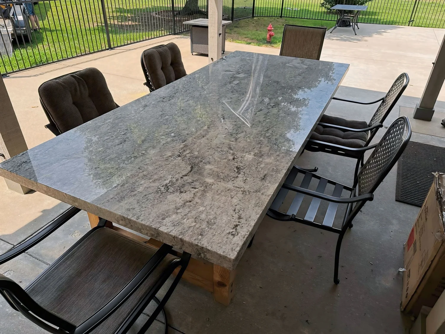 Dark custom stone bar top set over a stacked stone base, fabricated by Stone Restore Solutions in Grove, Oklahoma