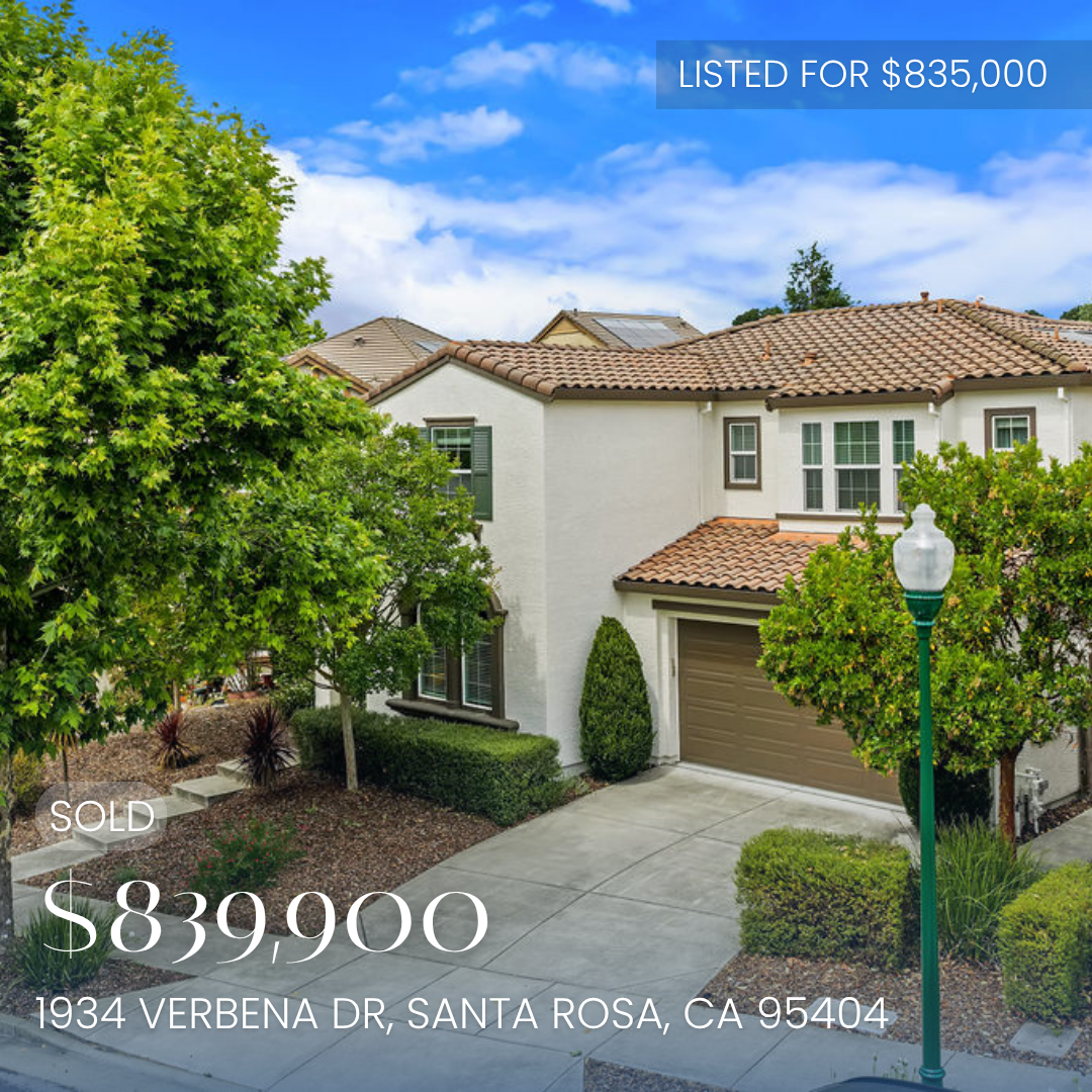 A two-story house with a beige garage door, reddish-tile roof, white walls, and multiple windows surrounded by trees and shrubs. A street lamp is in the foreground. Text overlay indicates the house is under contract, priced at $839,900, located at 1934 Verbena Dr, Santa Rosa, CA 95404.