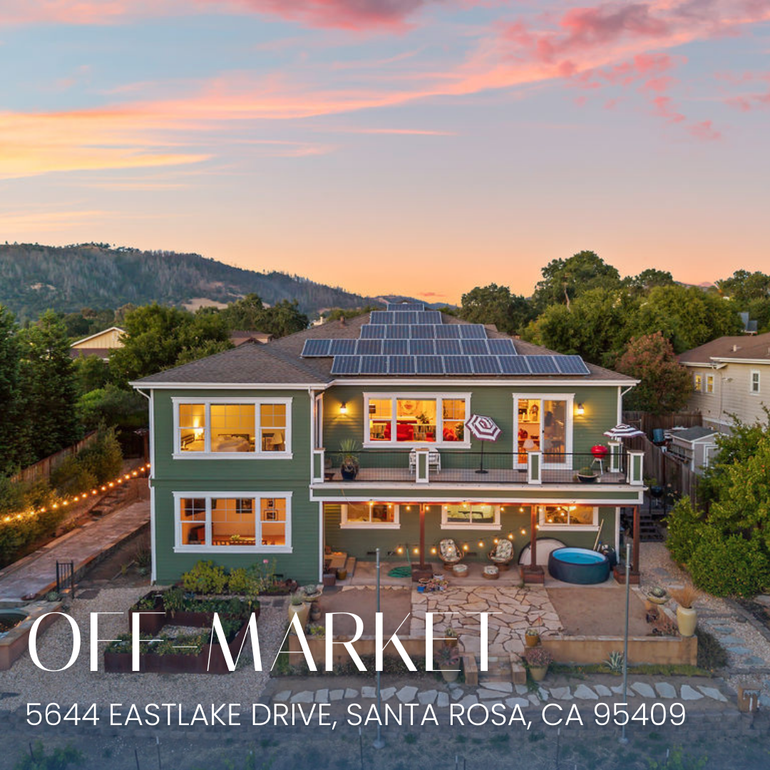 A large, green, two-story house with solar panels on the roof, illuminated by exterior lights during sunset, with a backyard that includes patio furniture, string lights, a hot tub, and a landscaped yard. The house is listed for sale at $2,000,000, located at 5644 Eastlake Drive, Santa Rosa, California.