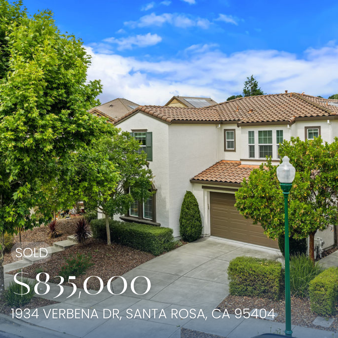 A two-story house with a beige garage door, reddish-tile roof, white walls, and multiple windows surrounded by trees and shrubs. A street lamp is in the foreground. Text overlay indicates the house is under contract, priced at $839,900, located at 1934 Verbena Dr, Santa Rosa, CA 95404.