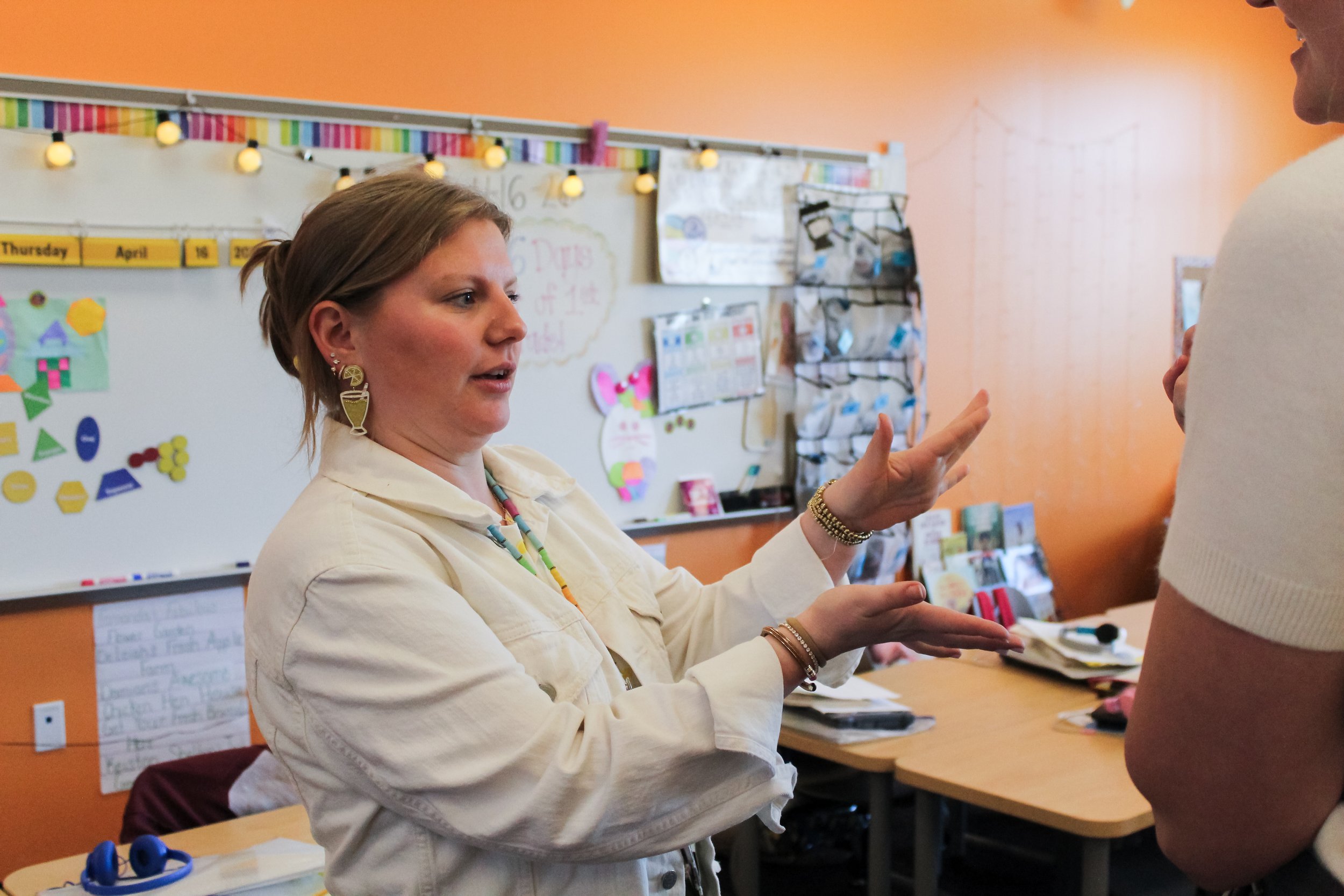 A teacher explaining the reading clinic.