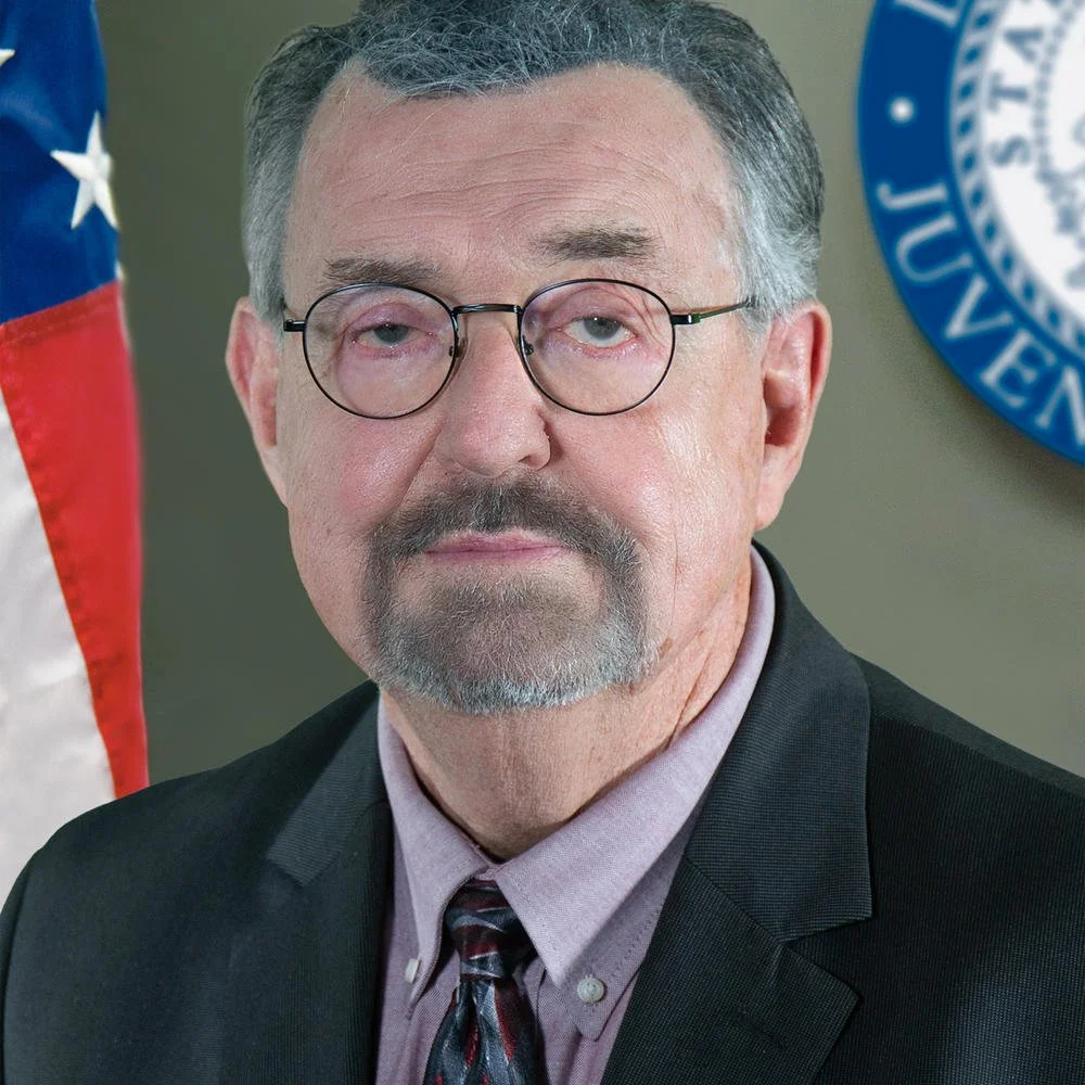 Headshot of Garry McGiboney.