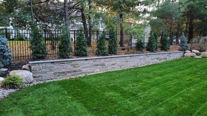 How a Retaining Wall Becomes the Most Useful Design Element on a Sloped Property in Andover, NJ