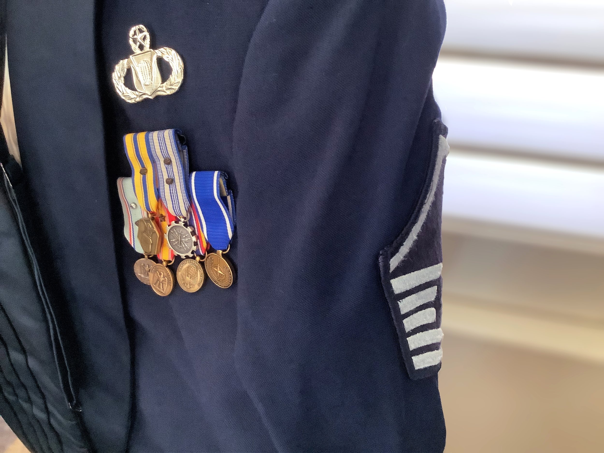 An old Air Force blues uniform, once worn by Dawn Scott's husband back in his days in the Air Force. It was kept in pristine condition for over 30 years and represents the support she gives him and their family every day.