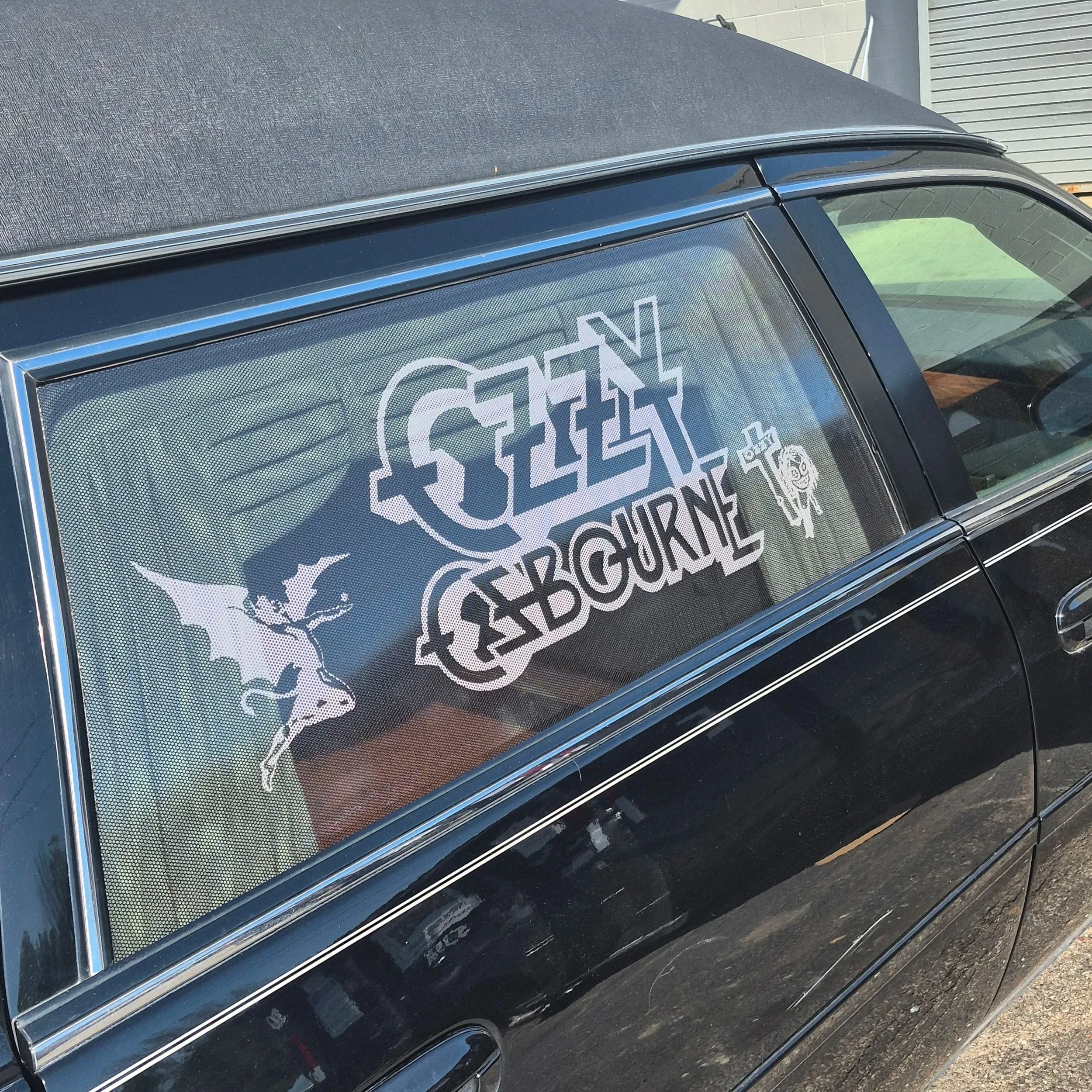 In the end, I think the slick black Cadillac hearse with the pop of the black and white graphics in the windows really worked in the design's favor and led to something classy and impactful. 