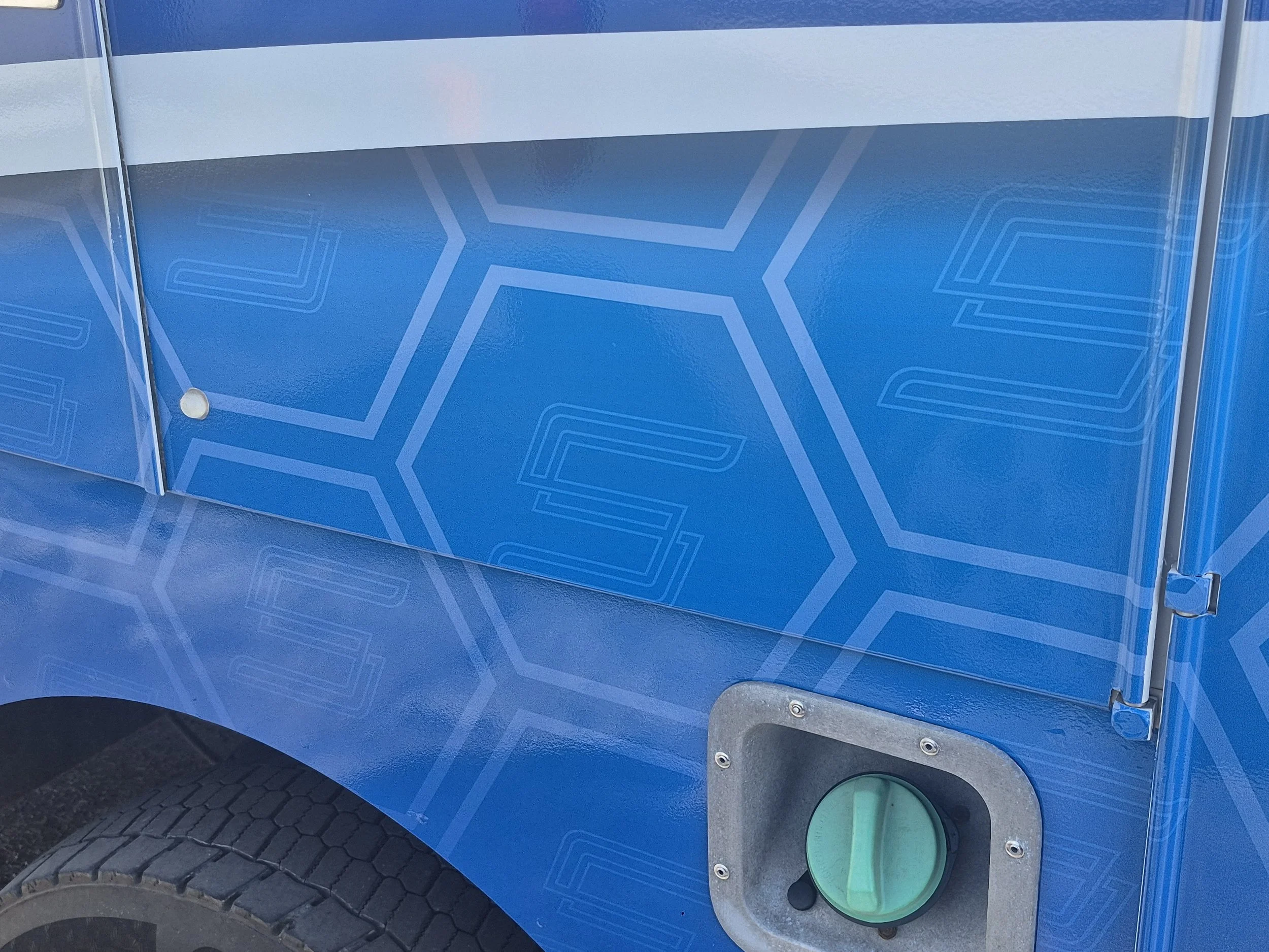 The repeating hex pattern with the Synergy "S" logo was a lot of fun to create and thematically ties the whole vehicle together. 