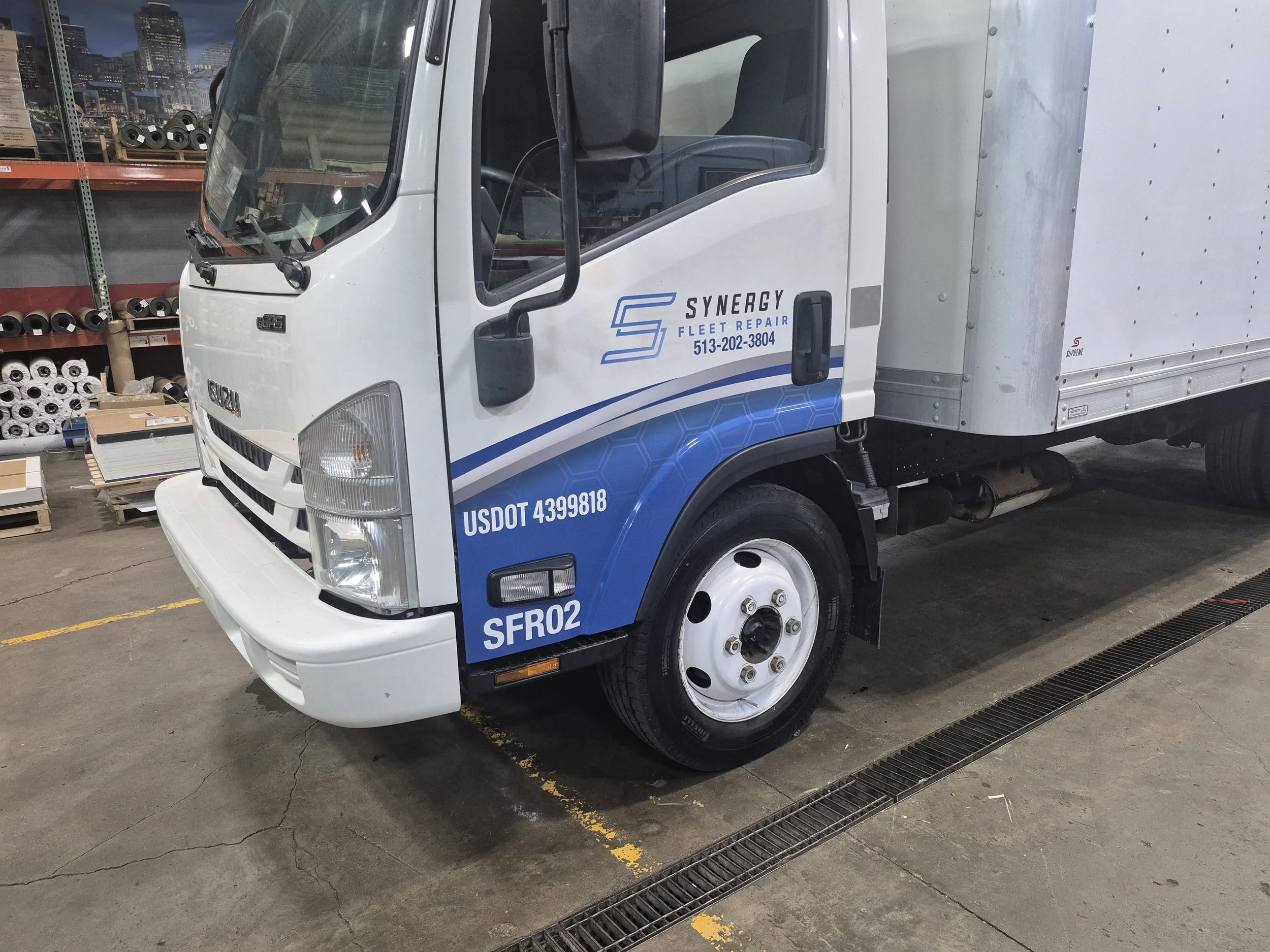An Isuzu truck for Synergy used the same general design, repurposed and edited to fit the wildly different body of this particular vehicle. 