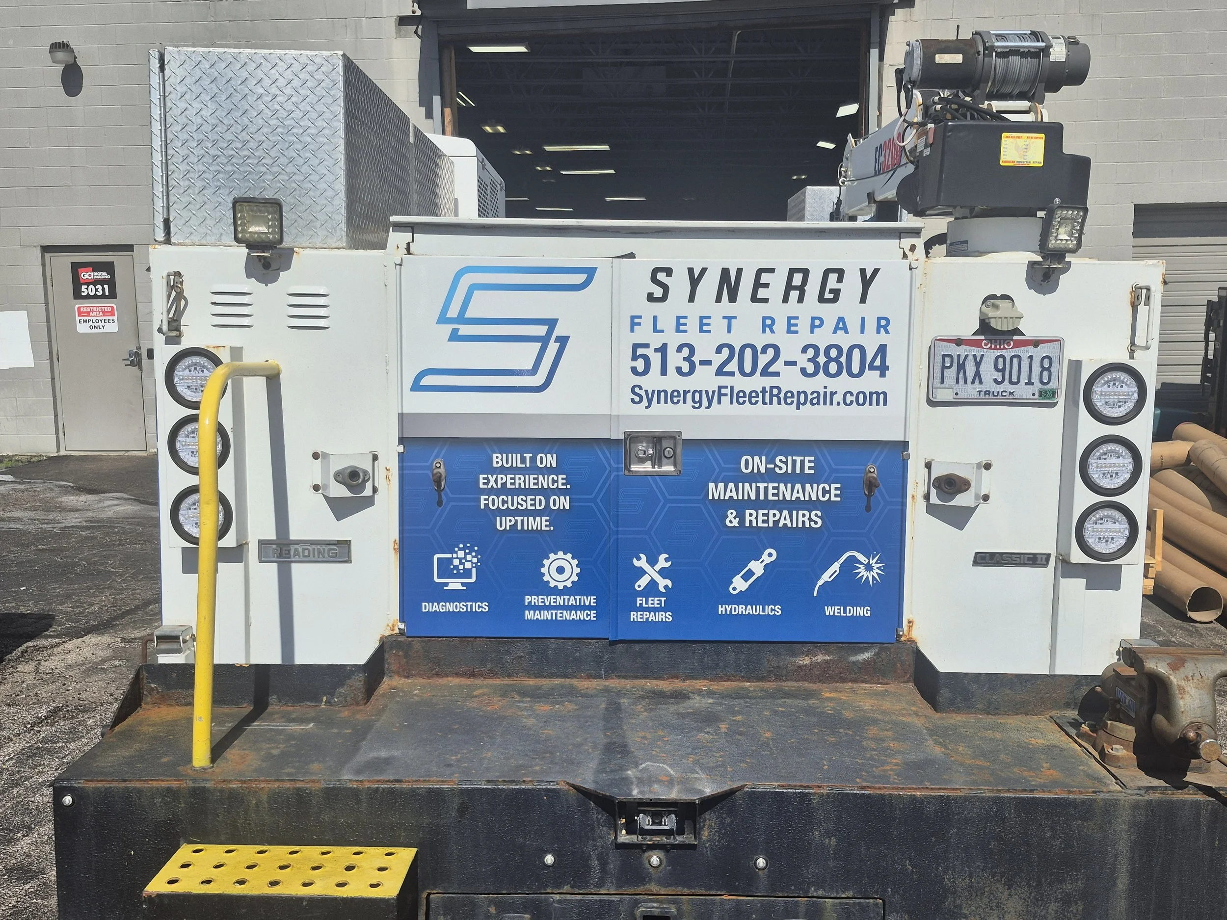 The rear was tricky!  The customer wanted all the information that was on the sides compressed down to the very small back doors.  It ended up being my favorite part of the vehicle.
