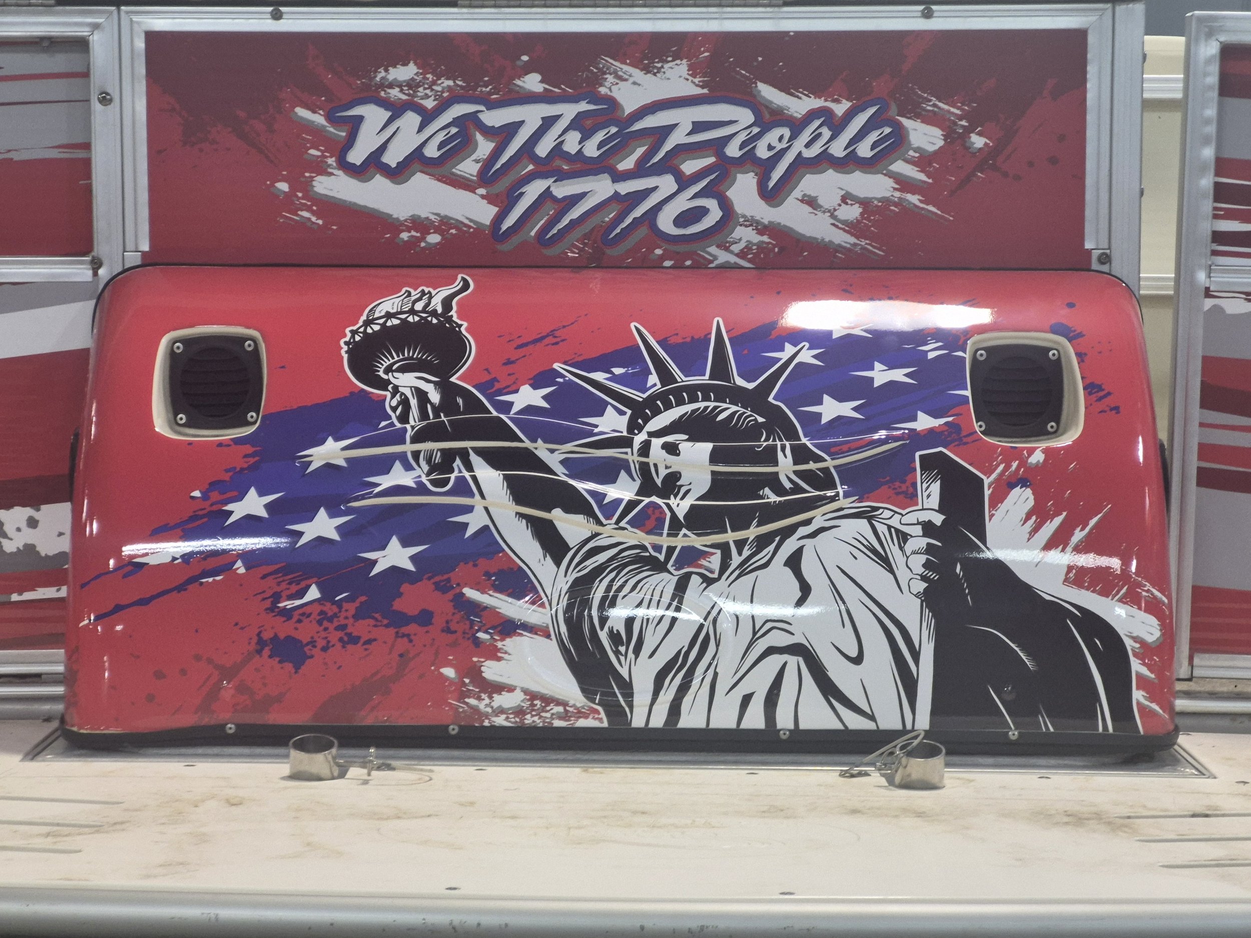 We had everything printed and ready to install, but when the customer dropped the boat off he asked if we could get the statue of liberty on there somewhere.  Despite the tight turn, we were able to make that a reality!