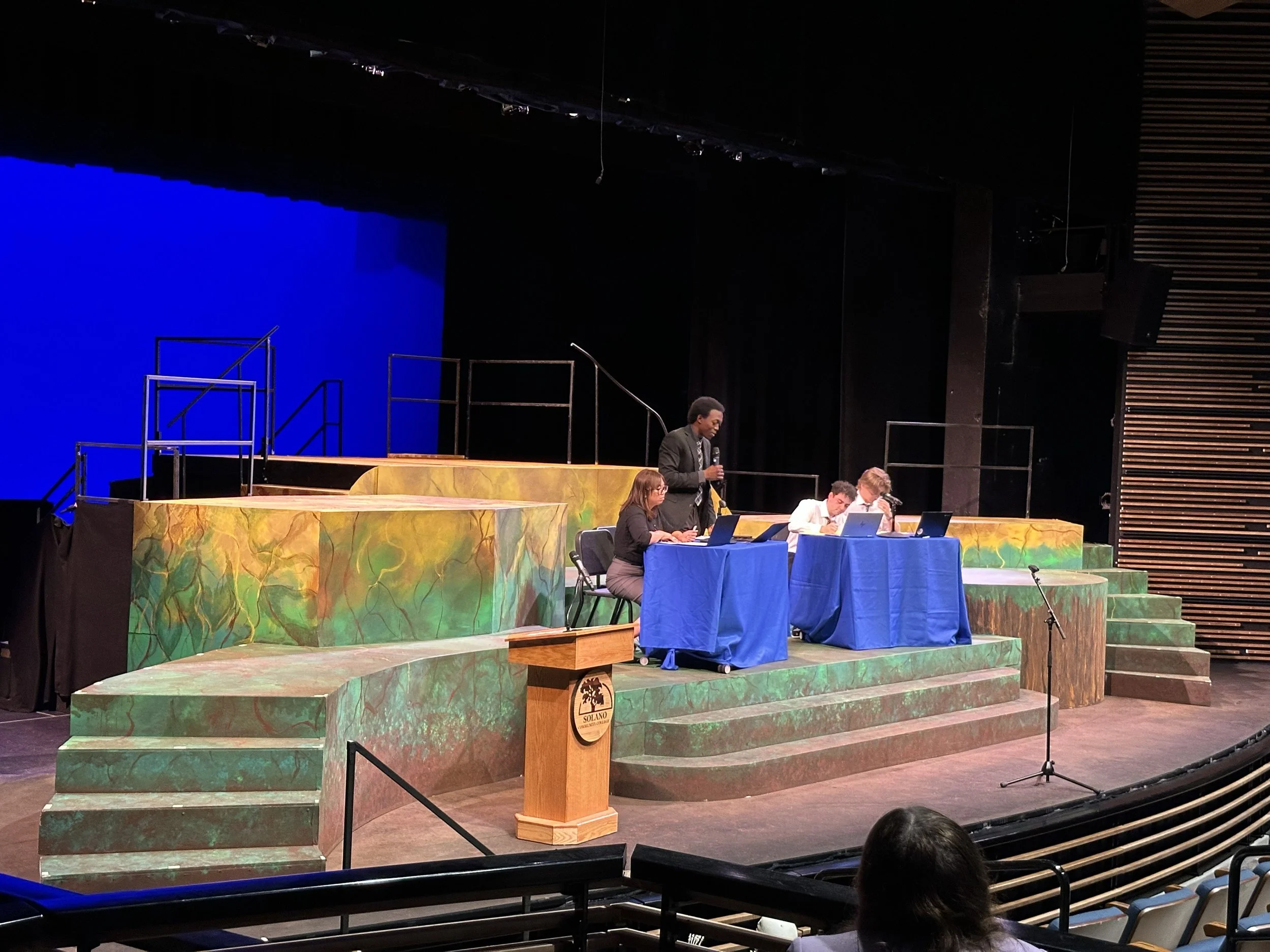 SCC Debate Team practices on the set for Everybody, SCT's 2025 fall play.