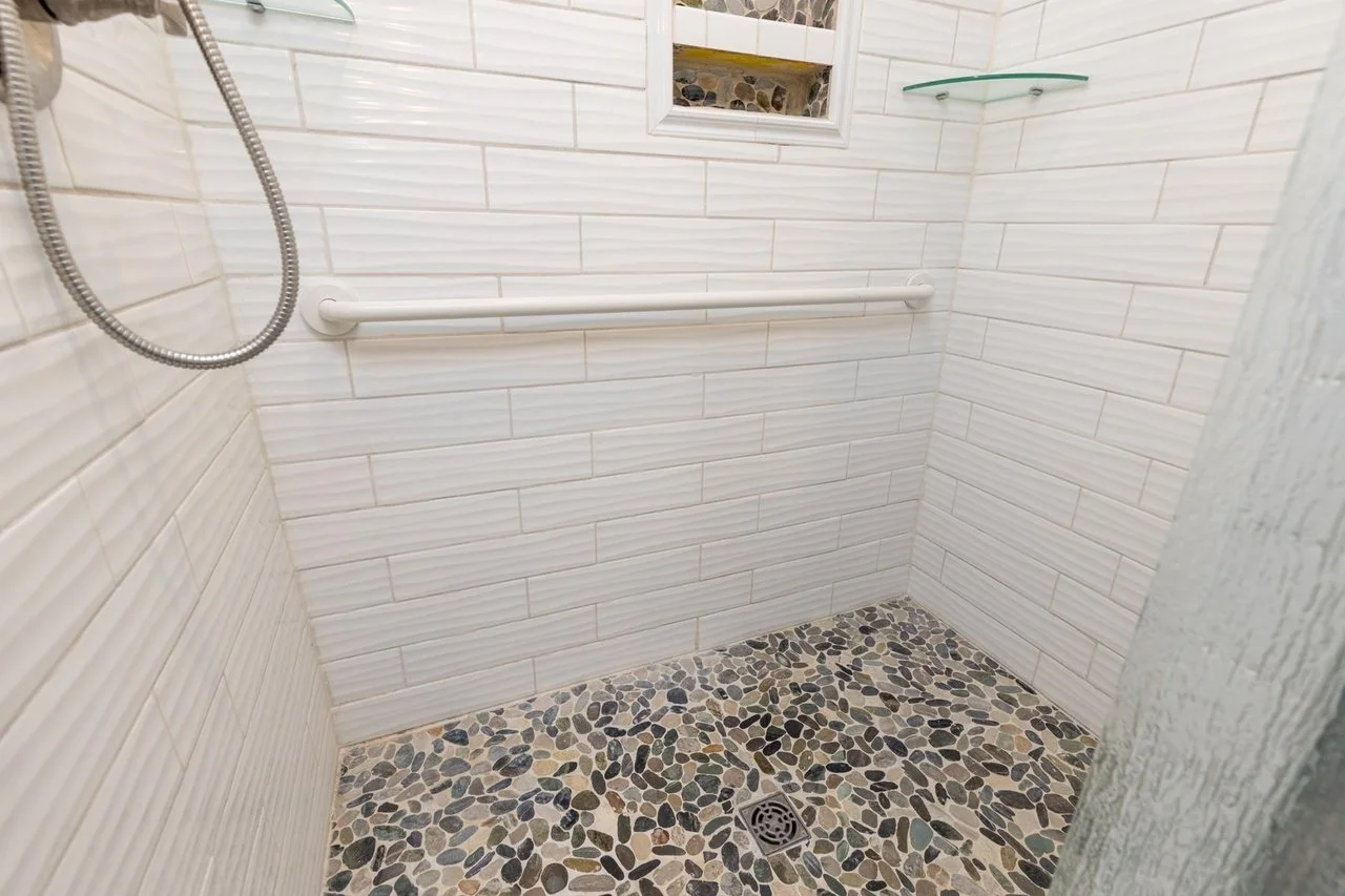 9 mallego bathroom pebble shower floor.jpg