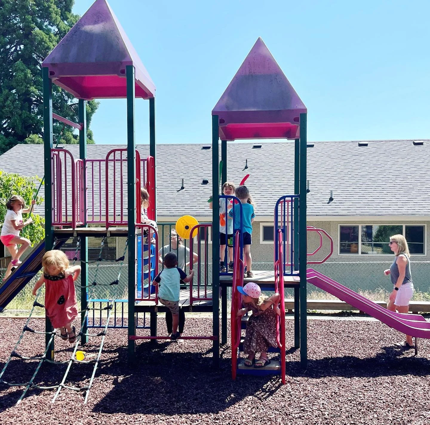 Preschool playground with children and teachers