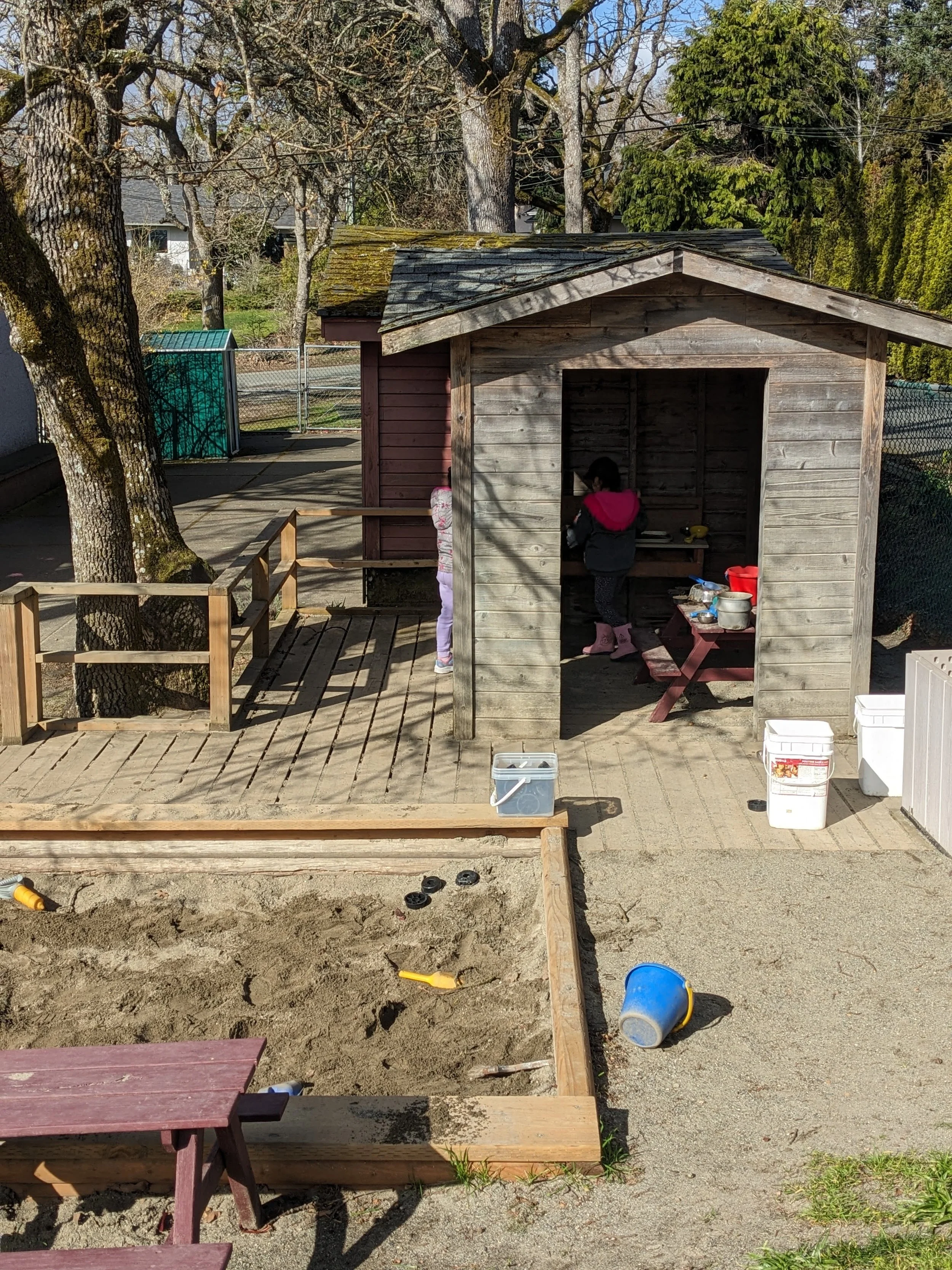 preschool backyard playhouse and sandbox