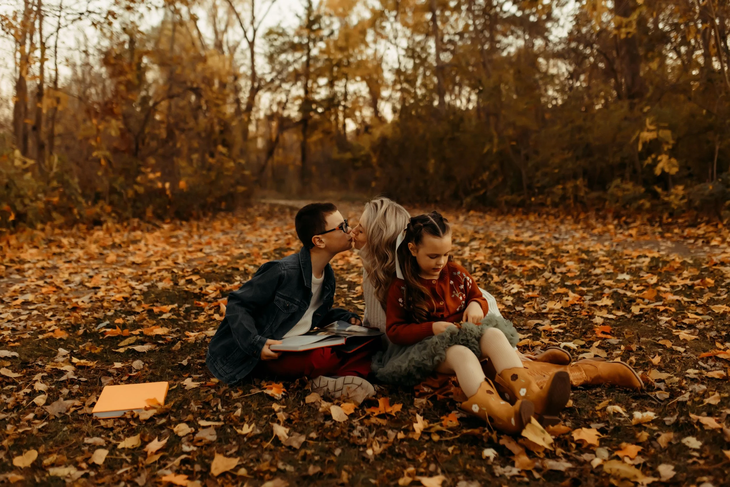 fall family photos in the colorful leaves in West Michigan