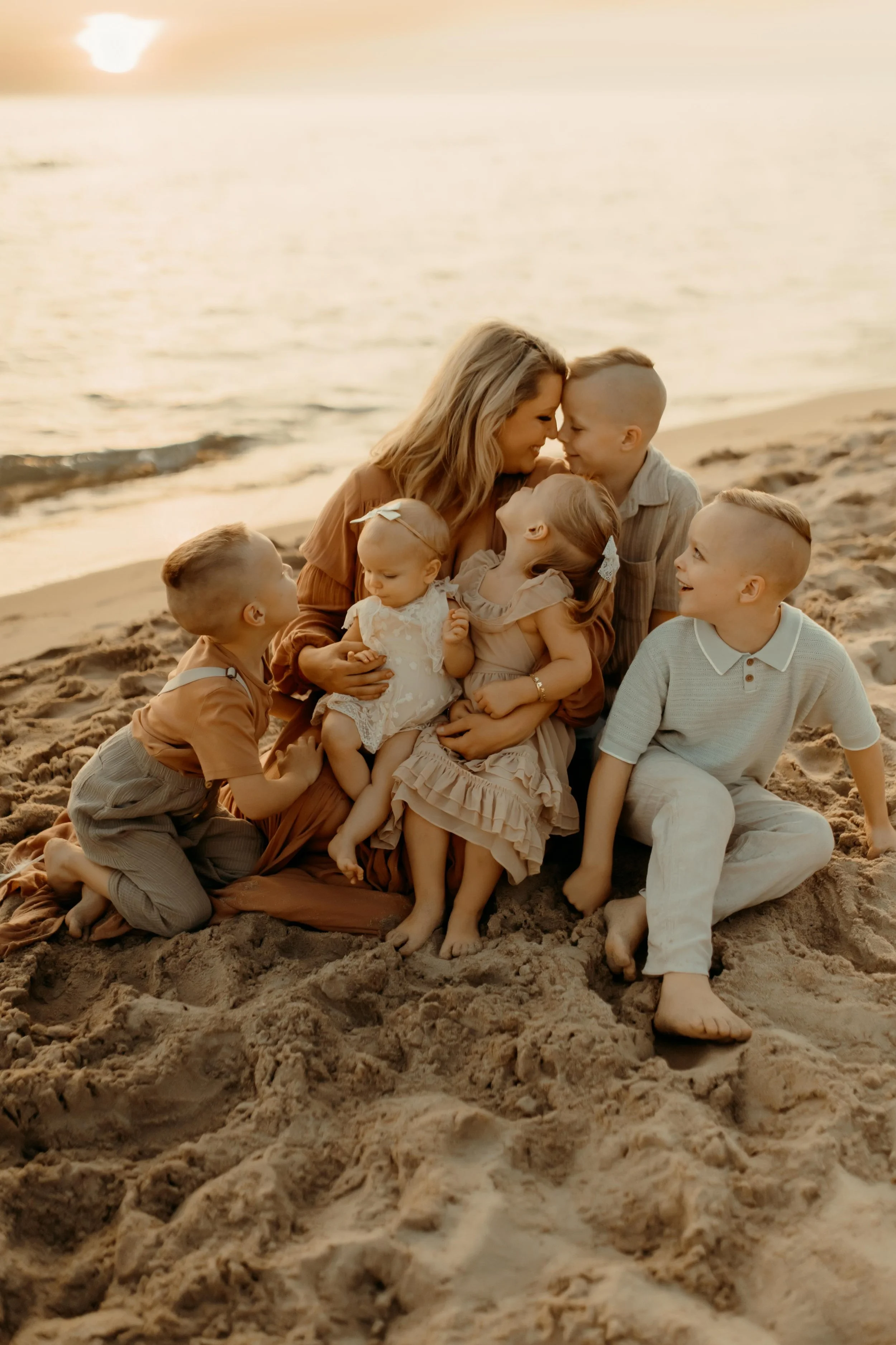 mom with her kids at the beach during family photography session