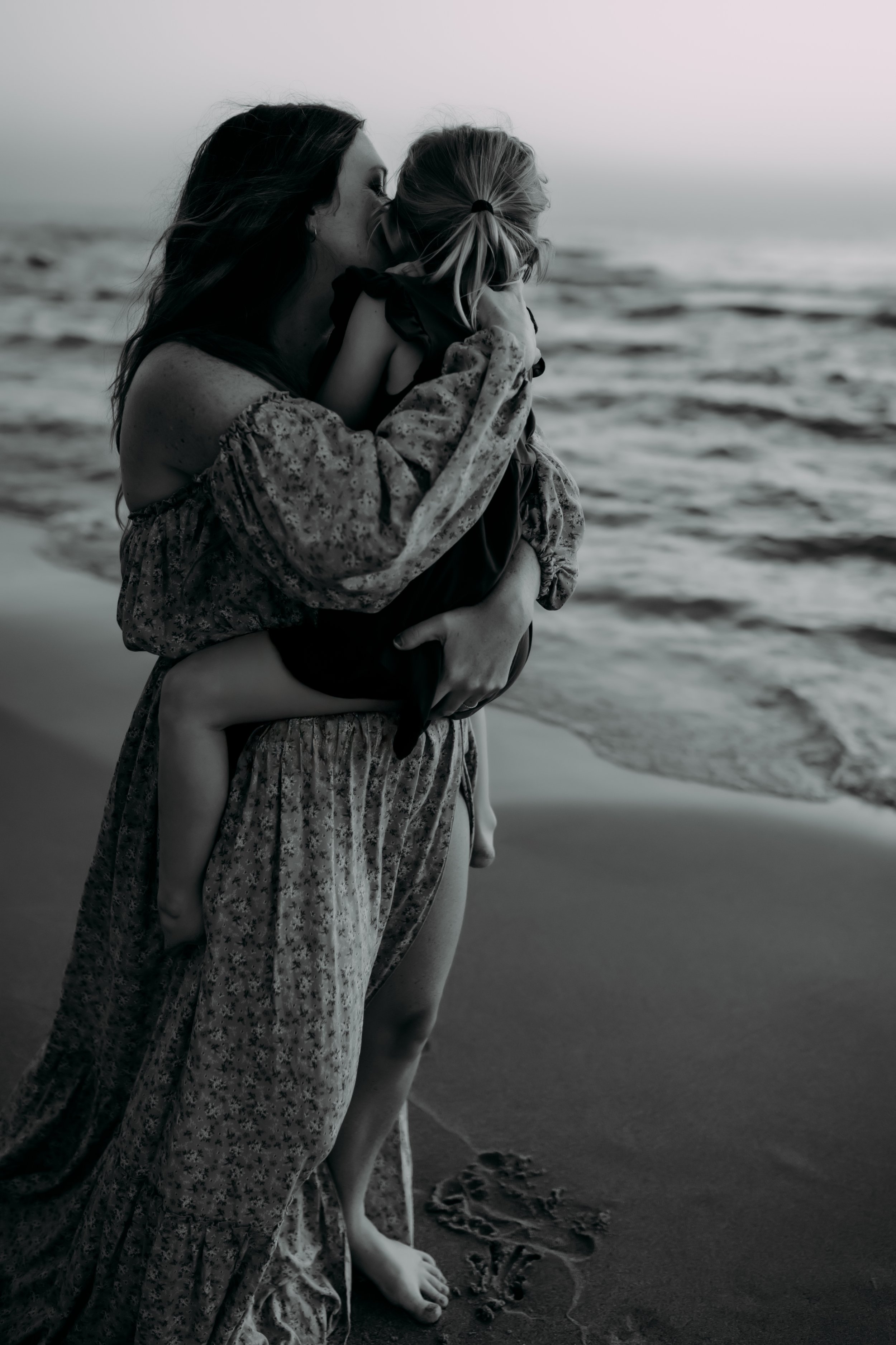 Mother and daughter along the beach in Holland, Michigan