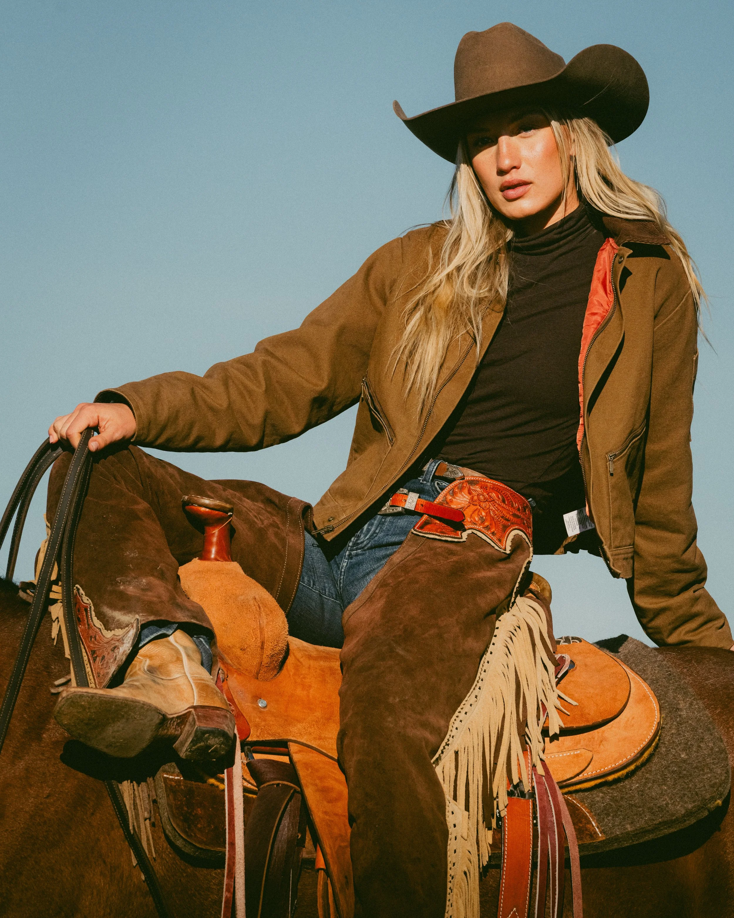 cowgirl on horse fashion pose