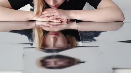 A subtle, minimalist image suggesting repetition or looping movement, representing recurring thought patterns.