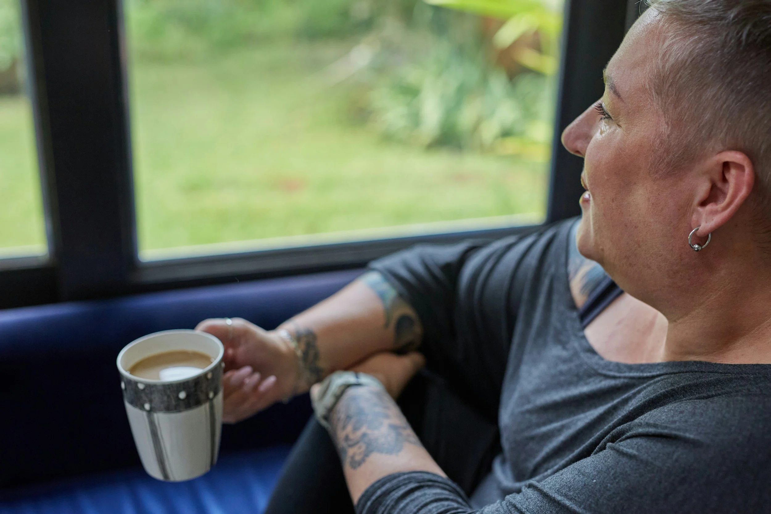 woman sitting quietly in reflective moment processing emotions after anger without overwhelm