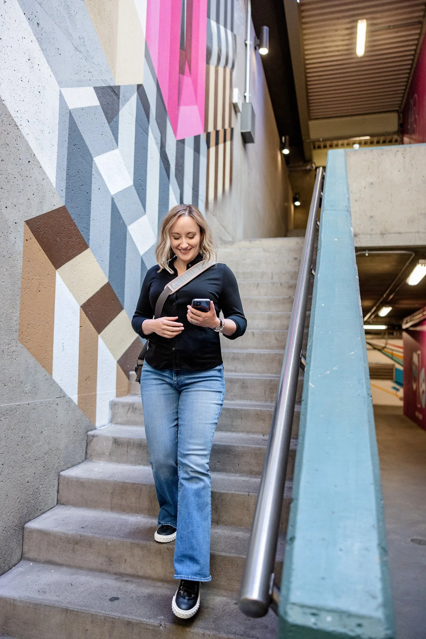 Melissa walking down stairs.