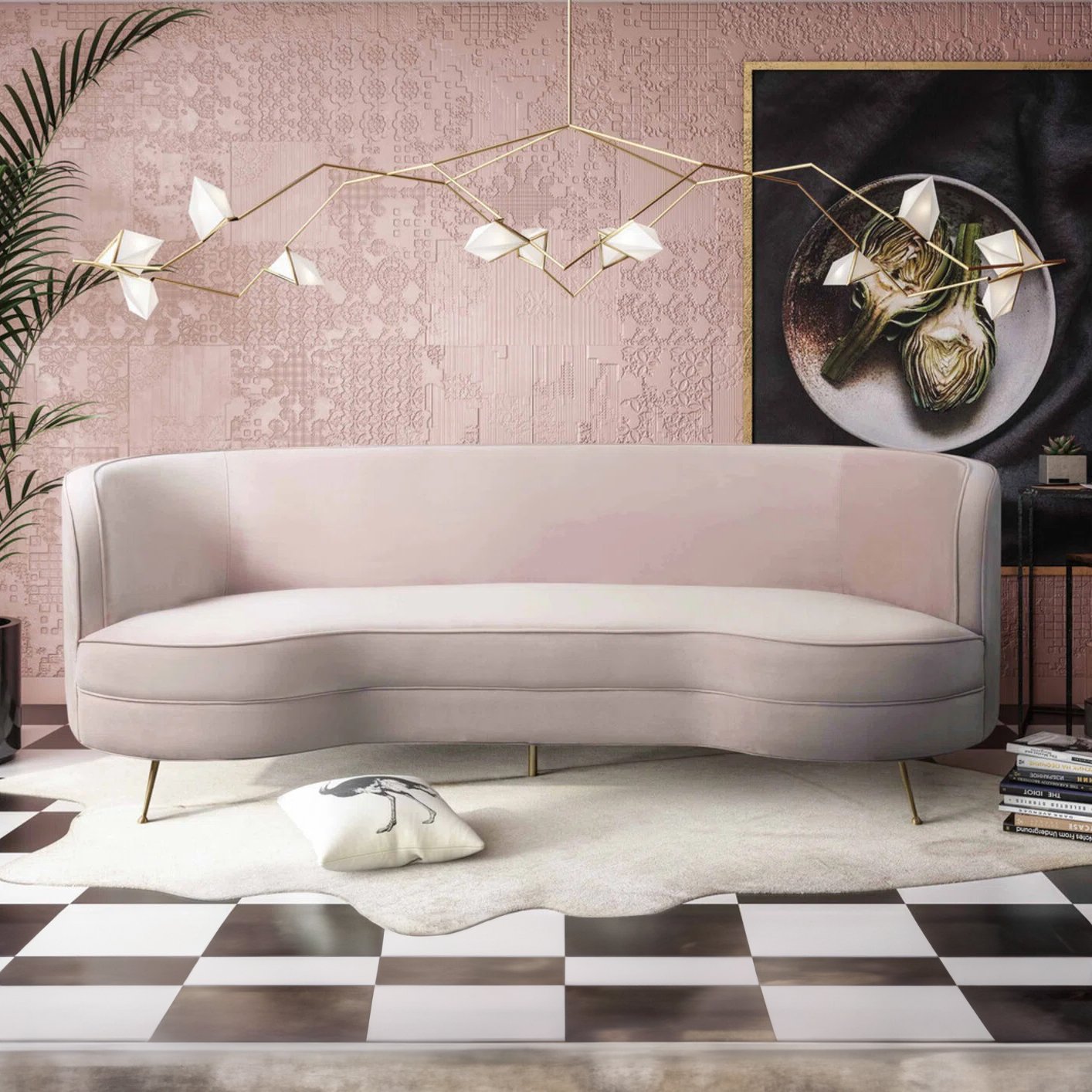 Elegant blush pink velvet sofa with a curved design, perfect for event rentals in Los Angeles