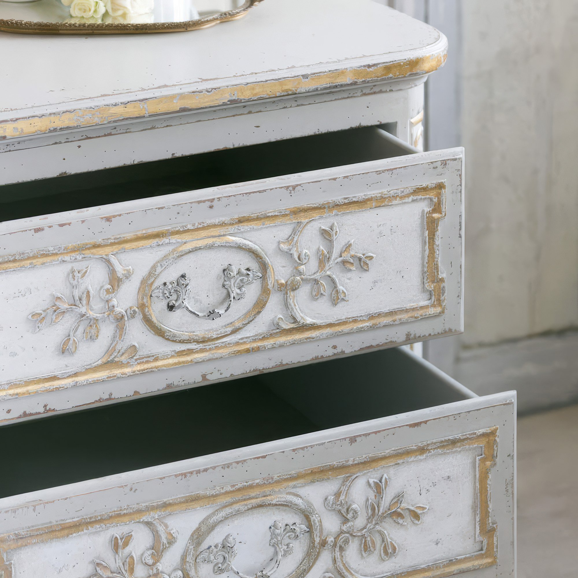 Antique-style nightstand with intricate carvings and Fleur de Lis finish, perfect for wedding and event rentals in Los Angeles