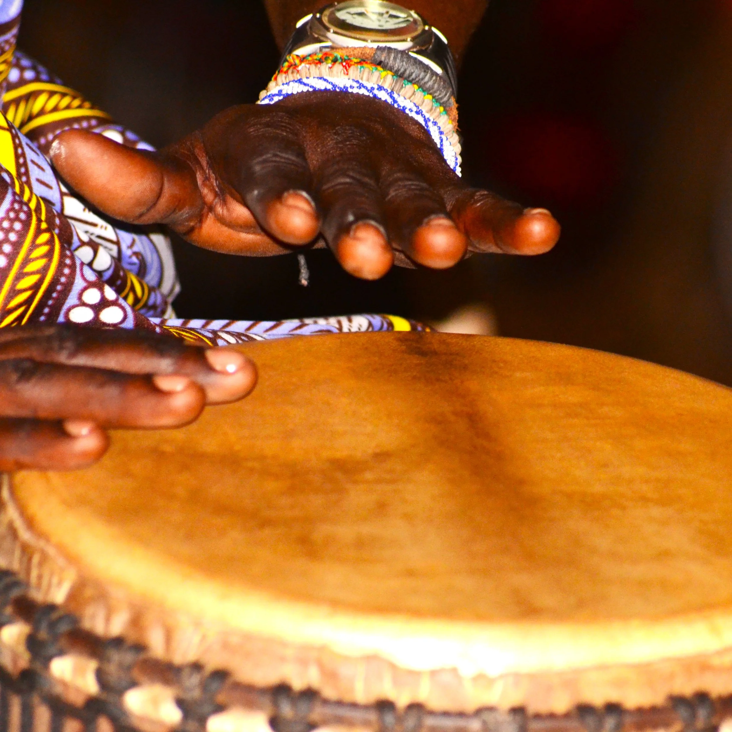 Photo of hands playing the congos in Togo, Africa.