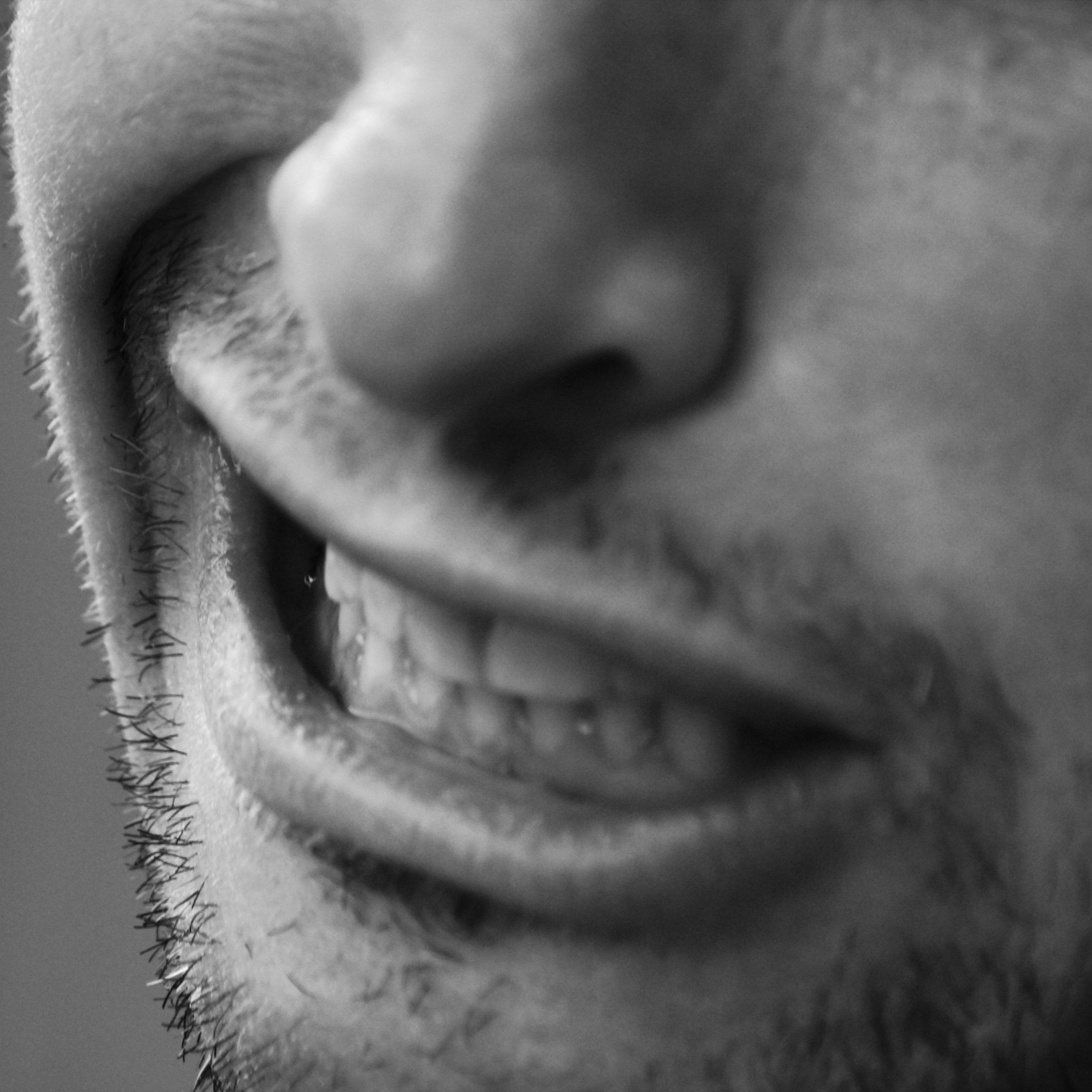 A photo of a quasi smile in black and white.