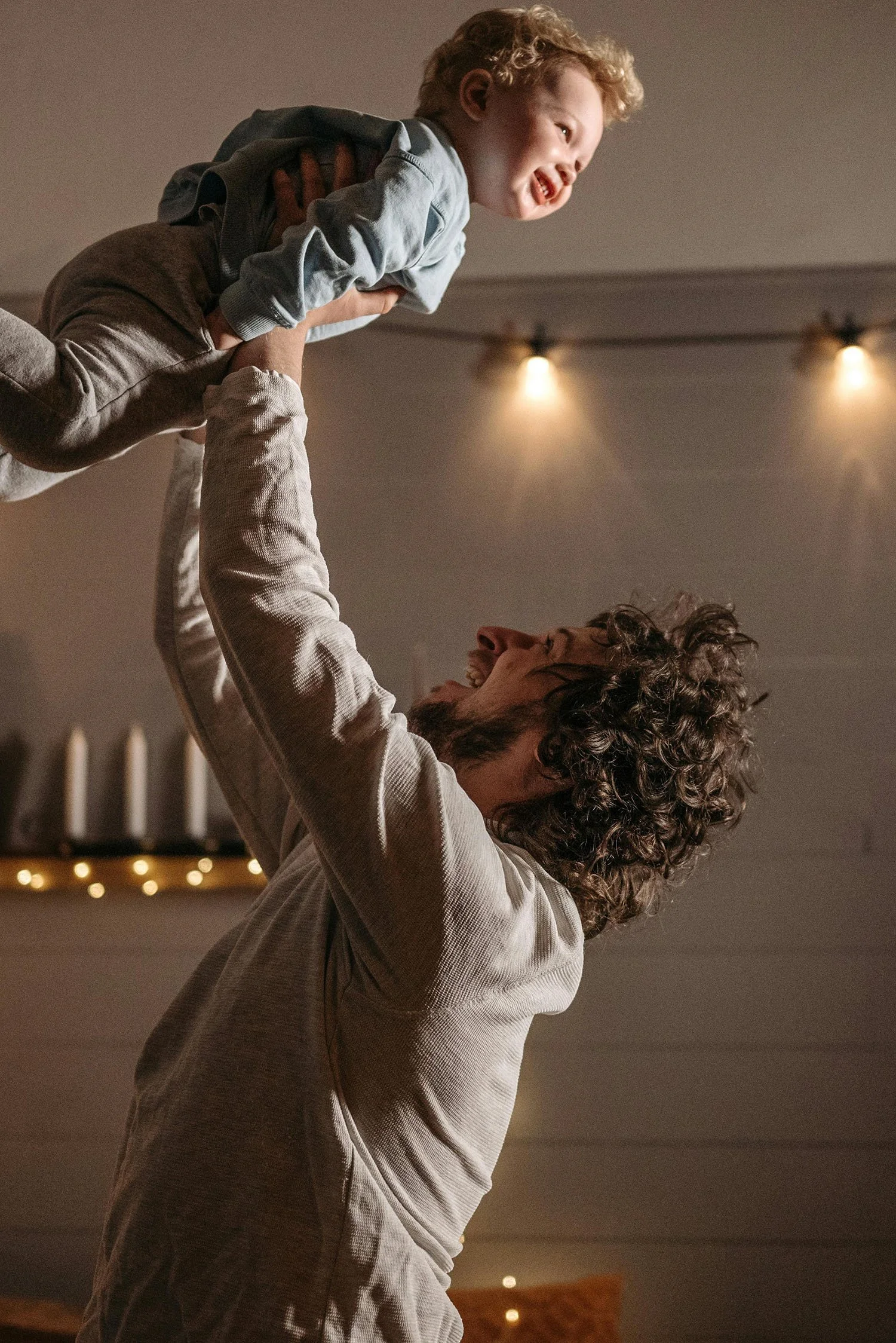 Parent playing with child indoors