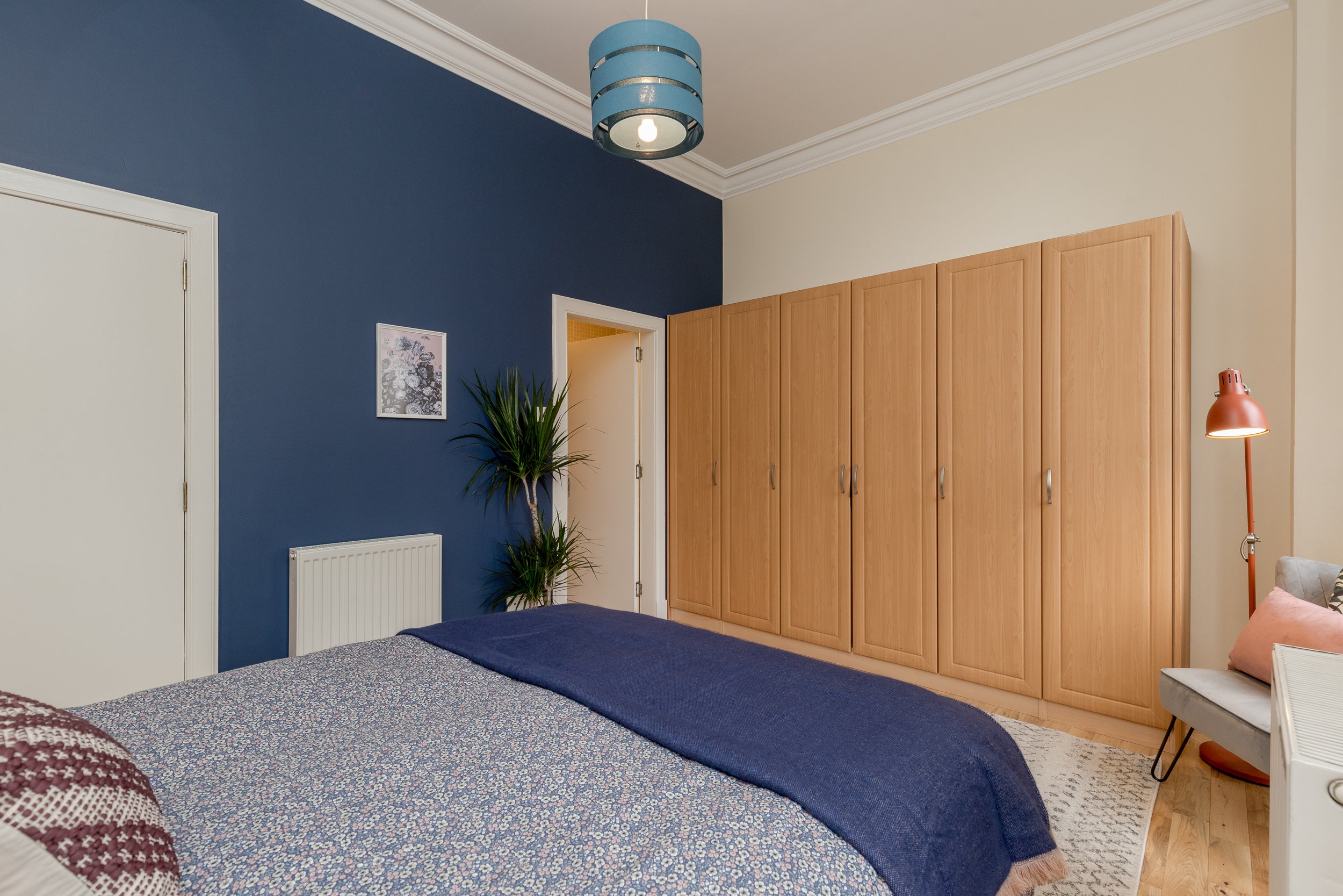 AFTER: The colour pop feature wall helps to balance the space.