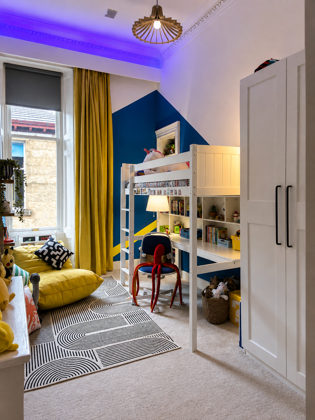 We had a bespoke pelmet made installing LED lights that can be changed to suit the mood. Shown on the blue setting here.