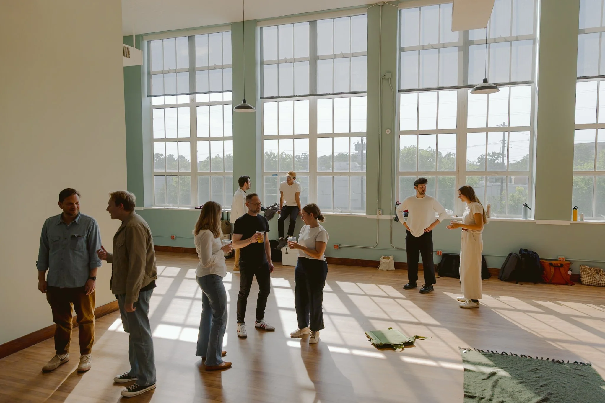 Fellows, Principals, and Clients chatting in Studio