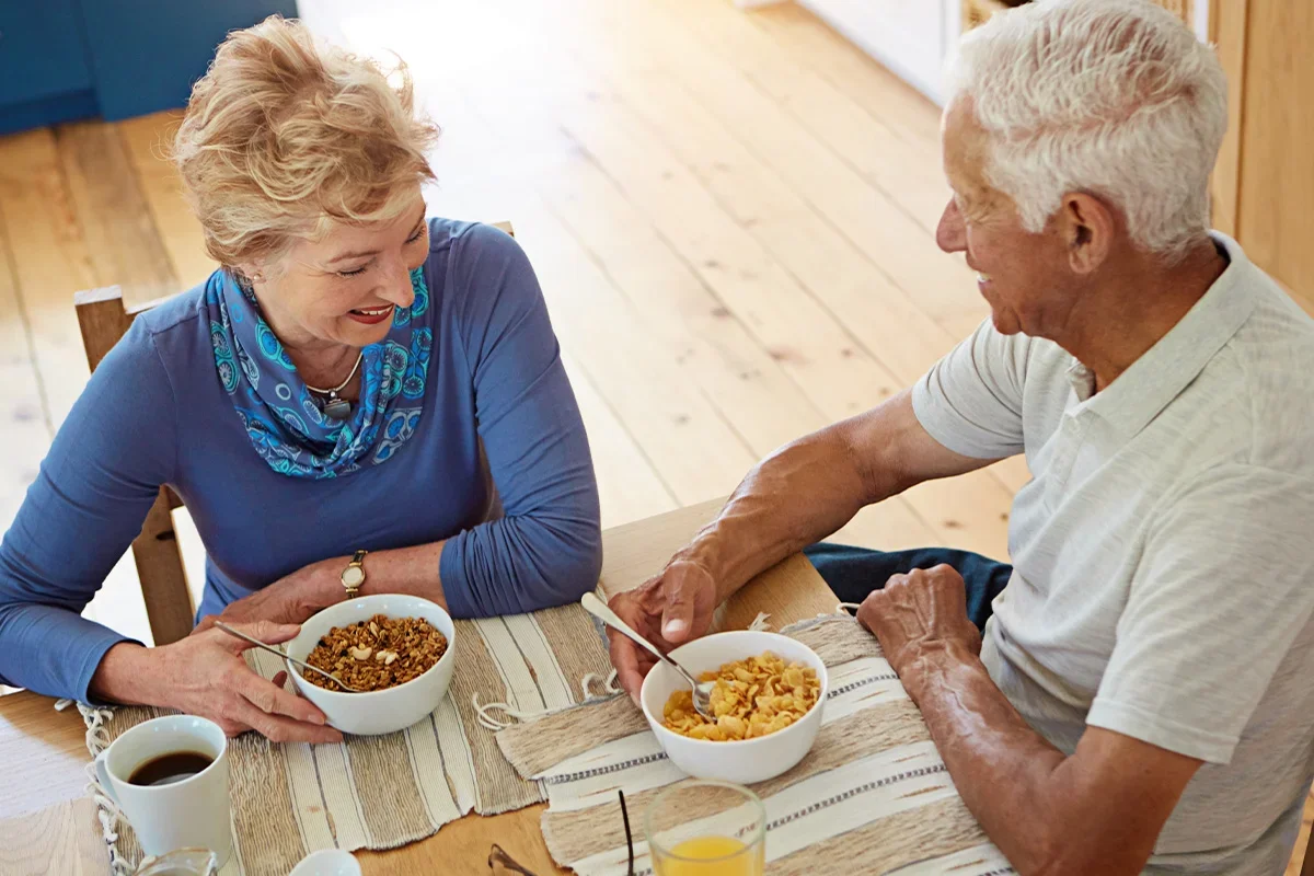 Older couple enjoying breakfast together, illustrating how Consumer segmentation research UK identifies behavioural and attitudinal differences across age groups to inform more effective marketing and product strategies.
