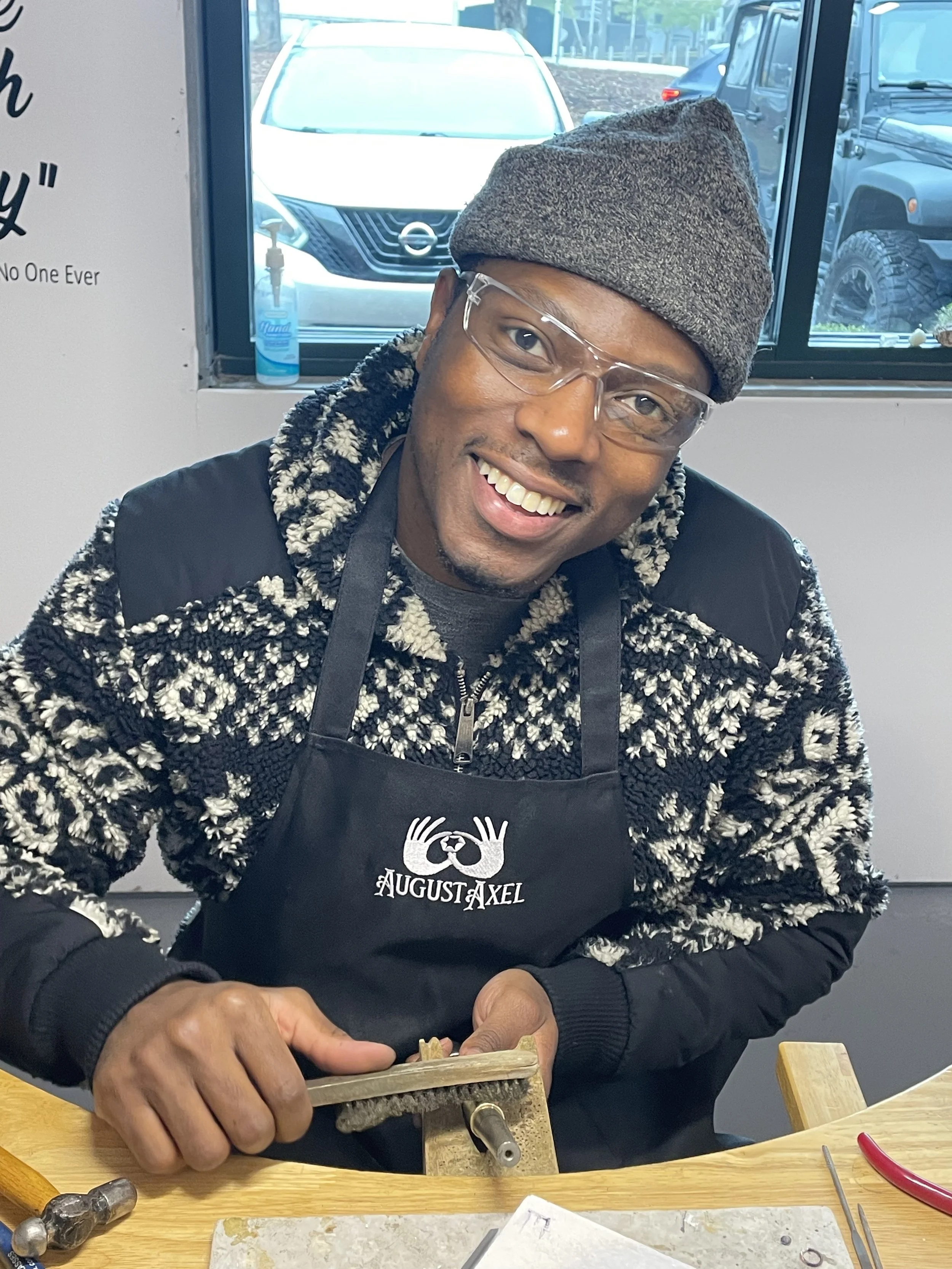 Man at a jewelry bench making rings