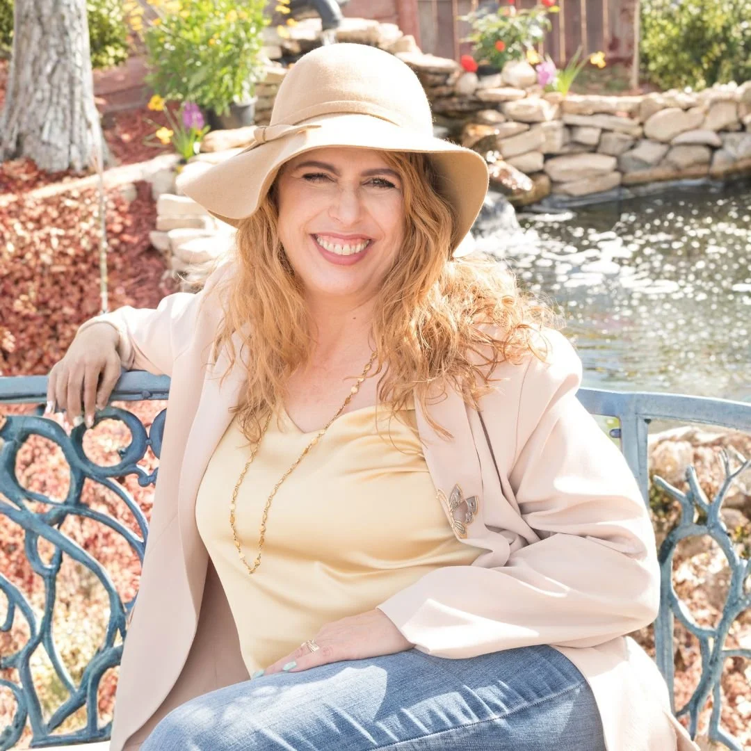 Eleanor Brown, a telehealth therapist in Texas, sitting peacefully by her backyard pond, practicing self-care and reflection.