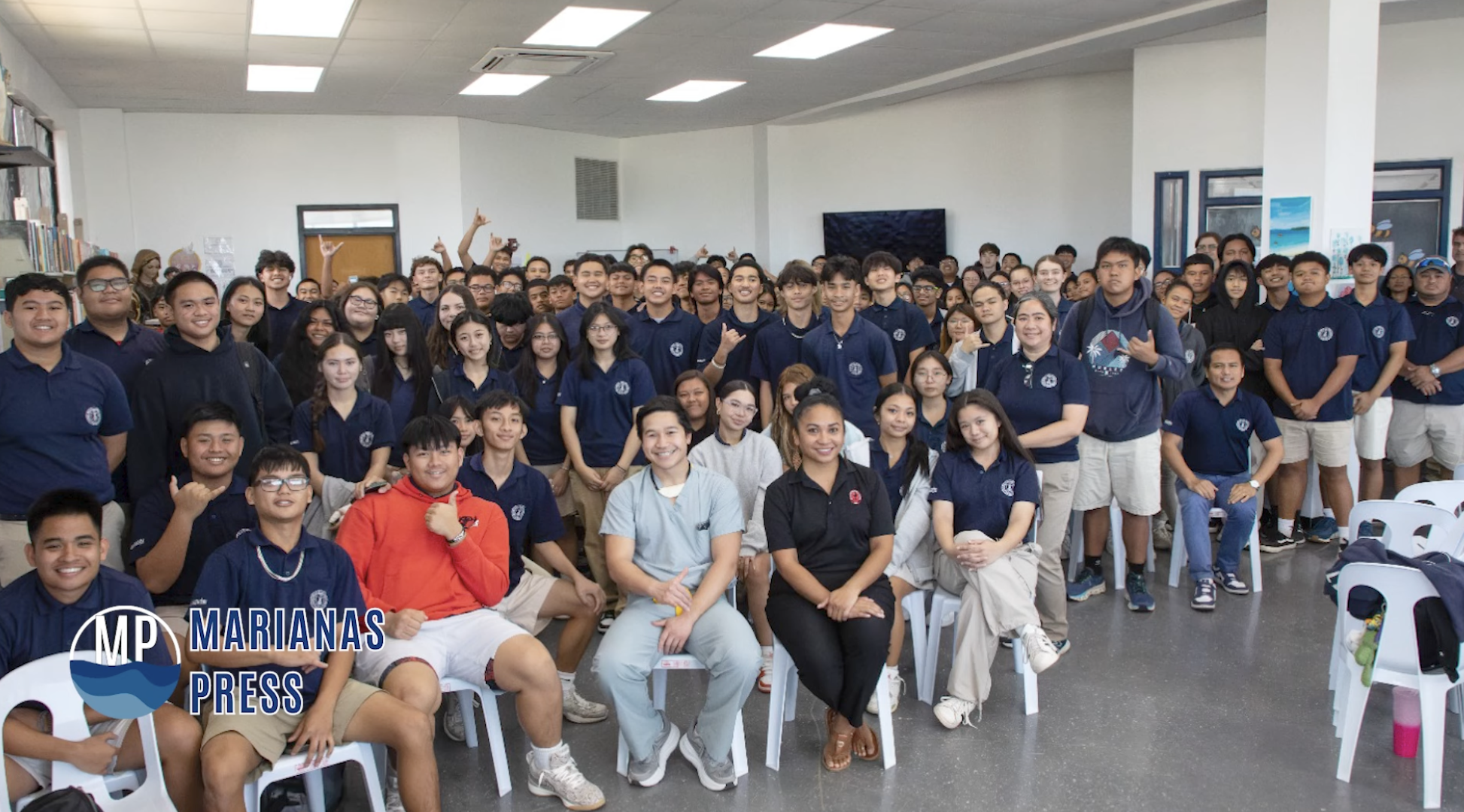 MS3 Ryan Benavente speaks to students at Mount Carmel school about careers in medicine.