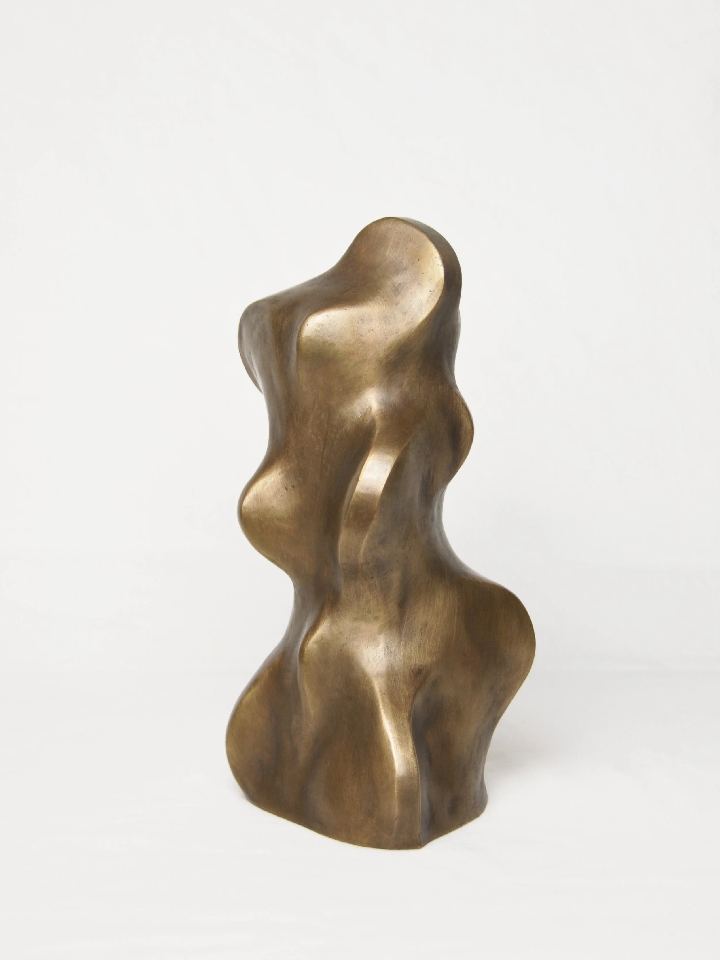 Bronze abstract sculpture of a curvy, organic shape against a plain white background.