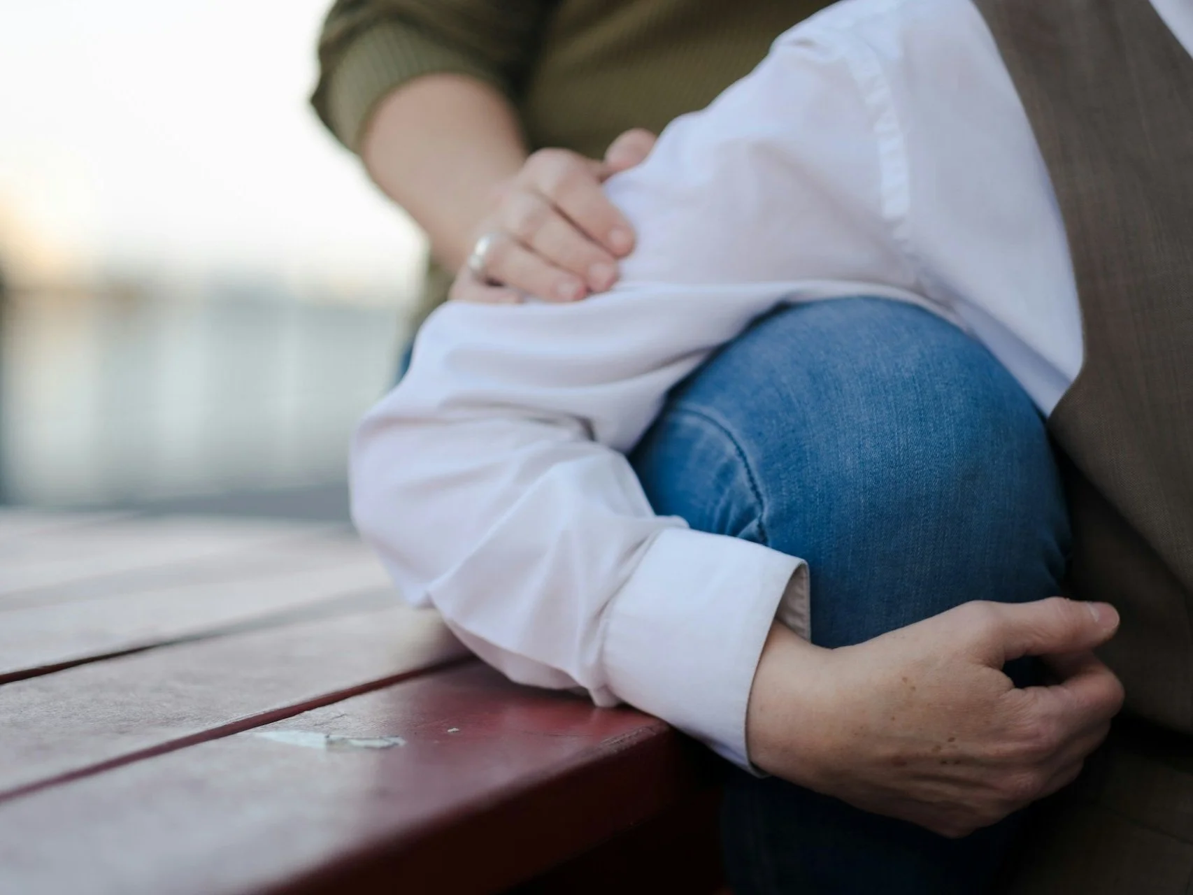 close up couple sitting together at picnic table