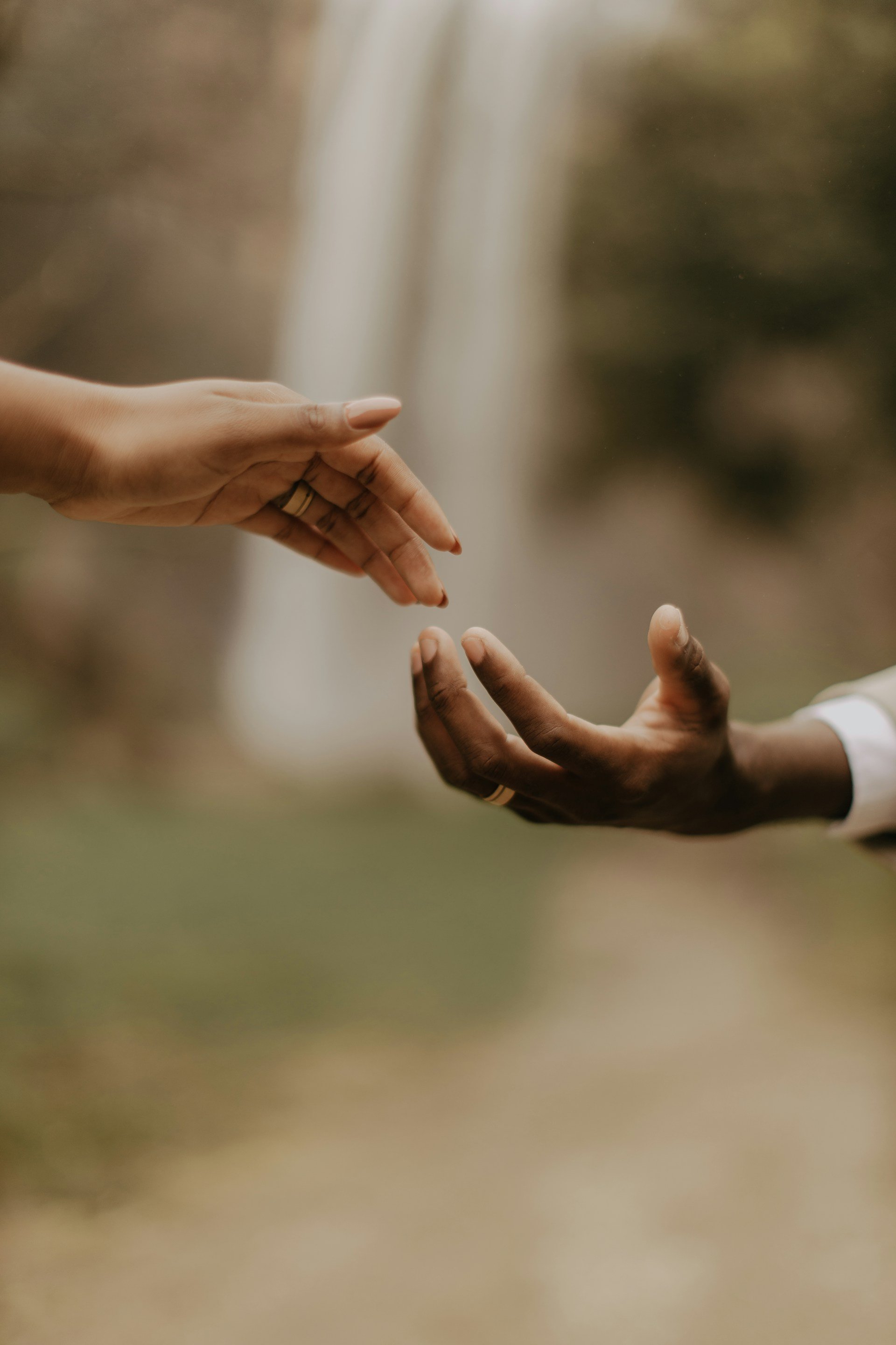 two hands touching fingertips