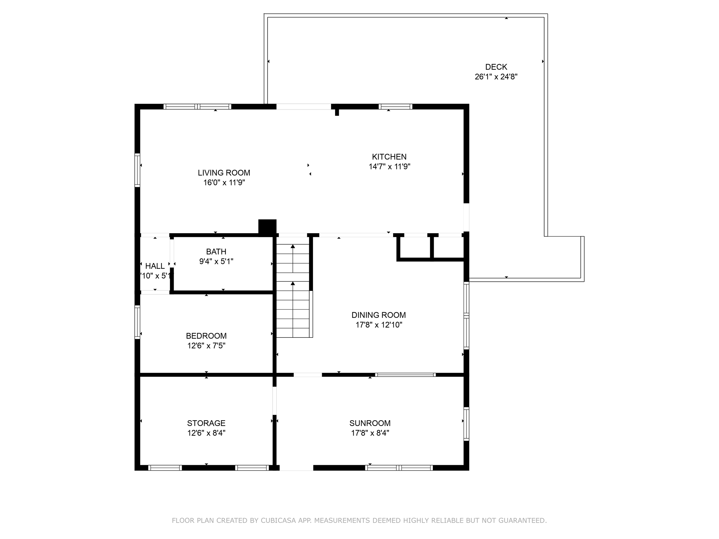 Floor plan of a house showing rooms including living room, kitchen, dining room, sunroom, bedroom, bathroom, storage, hall, and a deck outside.